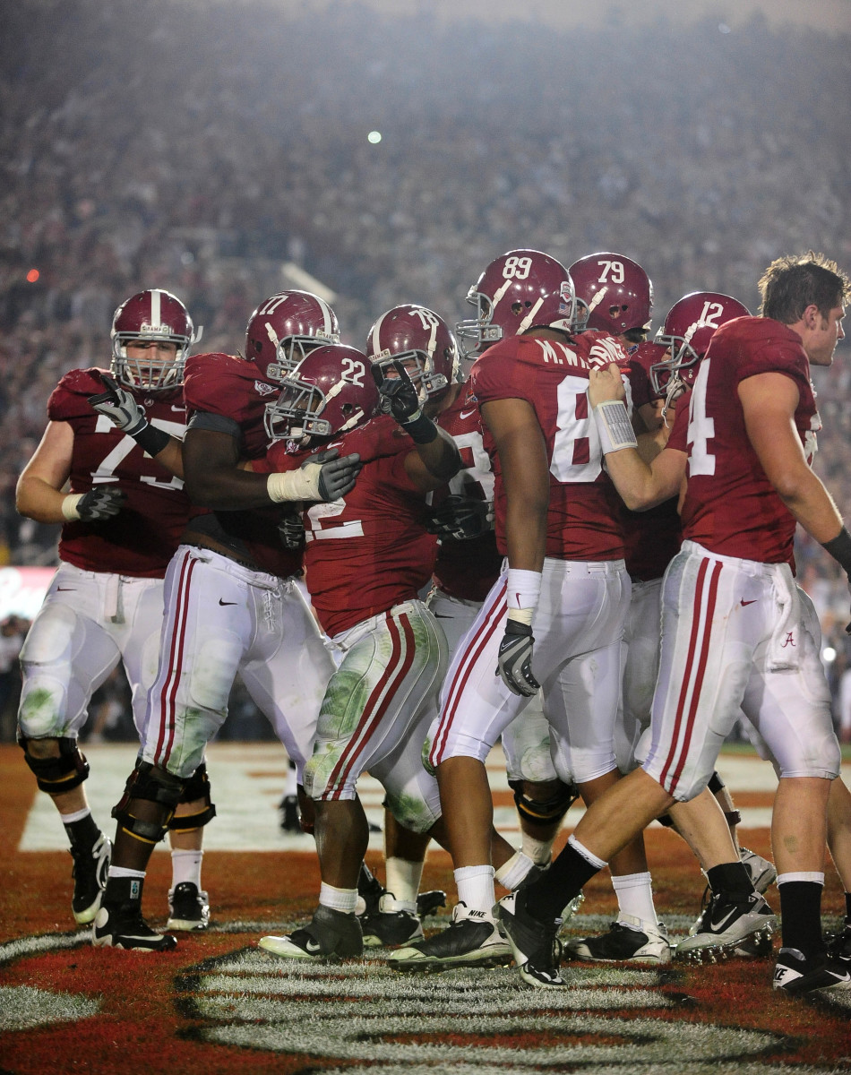 Jan 7, 2010; Pasadena, CA, USA; Alabama Crimson Tide running back Mark Ingram (22) celebrates with teammates after scoring a touchdown during the fourth quarter of the 2010 BCS national championship game against the Texas Longhorns at the Rose Bowl. Mandatory Credit: Mark J. Rebilas-USA TODAY Sports