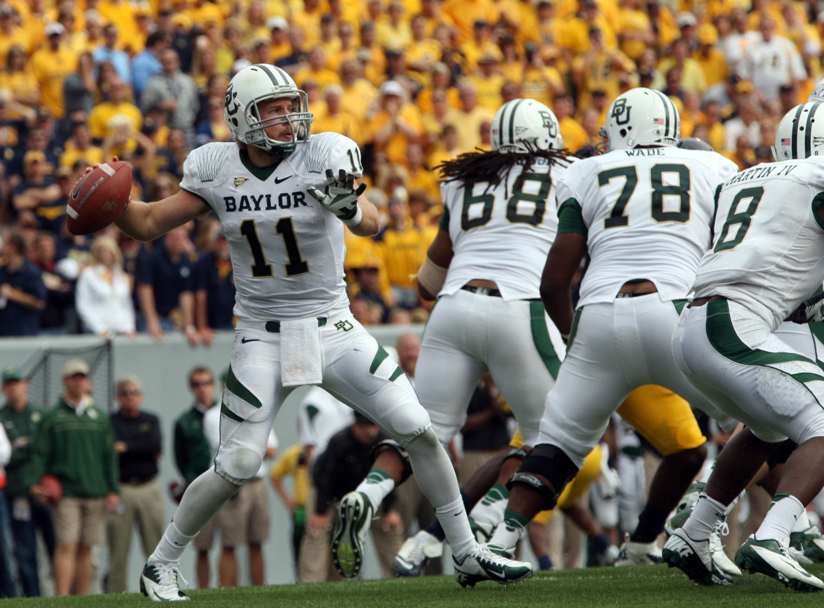 September 29, 2012; Morgantown, WV, USA; Baylor Bears quarterback Nick Florence (11) drops back to pass against the West Virginia Mountaineers in the second half at Milan Puskar Stadium. West Virginia defeated Baylor 70-63.