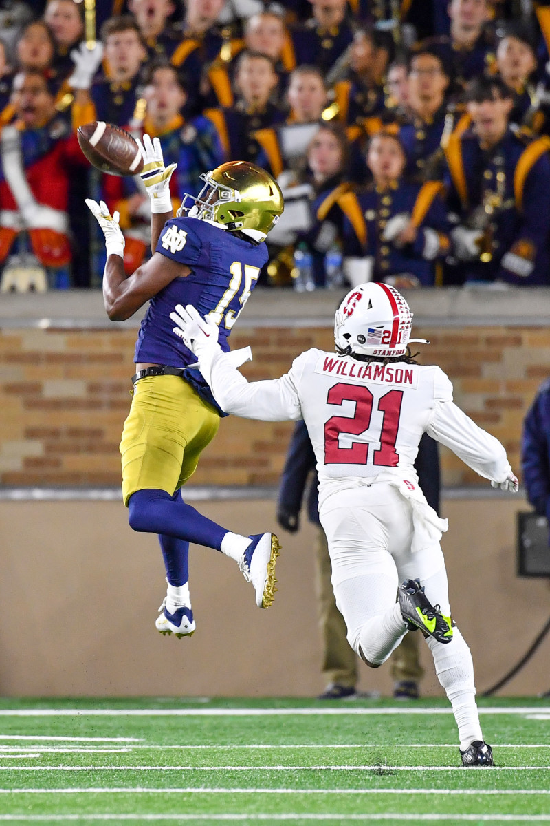 Oct 15, 2022; South Bend, Indiana, USA; Notre Dame Fighting Irish wide receiver Tobias Merriweather (15) catches a pass for a touchdown as Stanford Cardinal safety Kendall Williamson (21) defends in the fourth quarter at Notre Dame Stadium.
