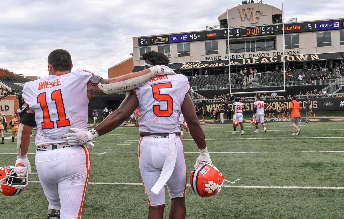 Clemson defensive lineman Bryan Bresee (11) and defensive end K.J. Henry (5) walk off the field together after the Tigers beat Wake Forest 51-45, at Truist Field in Winston-Salem, North Carolina Saturday, September 24, 2022.