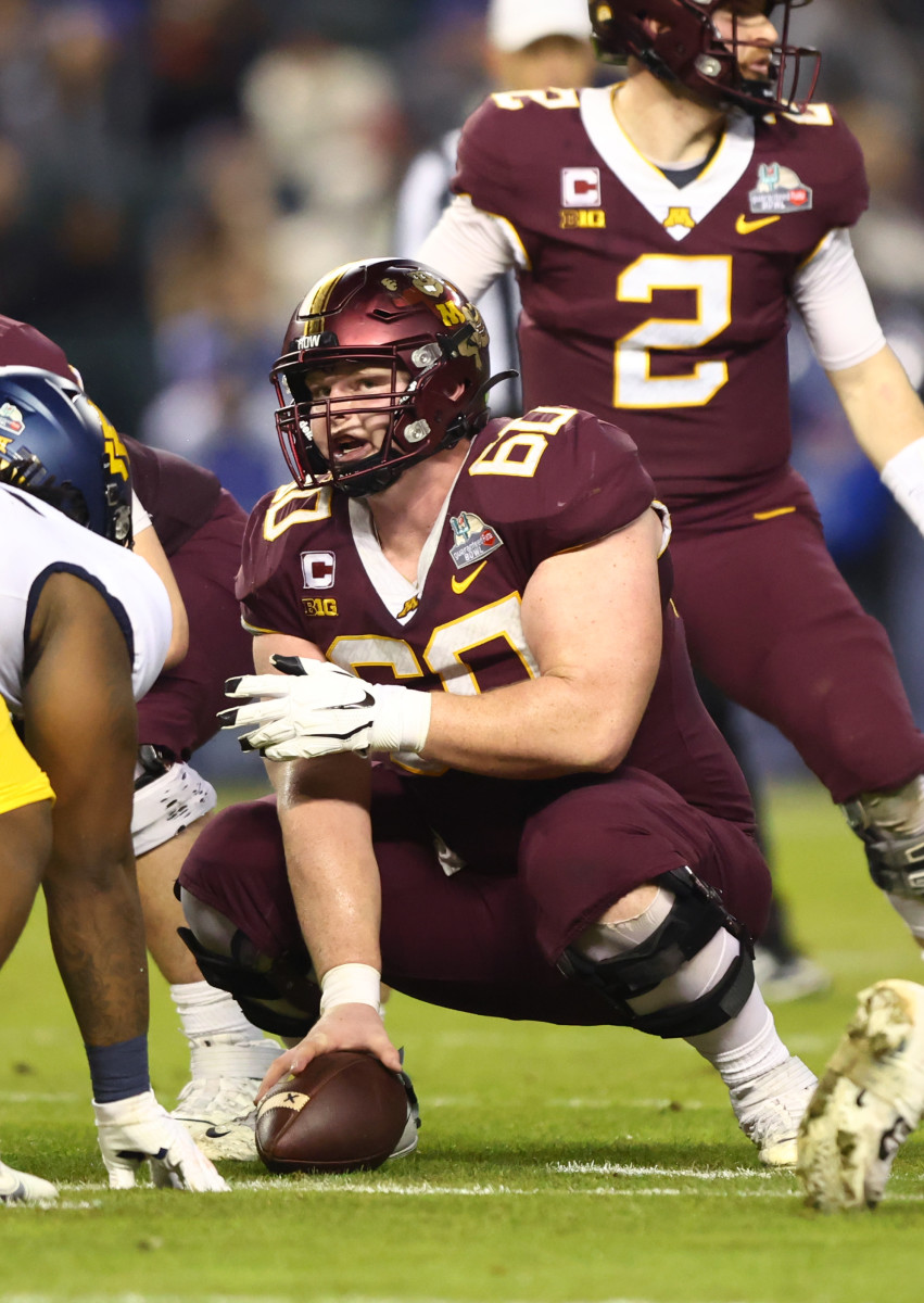 Dec 28, 2021; Phoenix, AZ, USA; Minnesota Golden Gophers center John Michael Schmitz (60) against the West Virginia Mountaineers in the Guaranteed Rate Bowl at Chase Field.