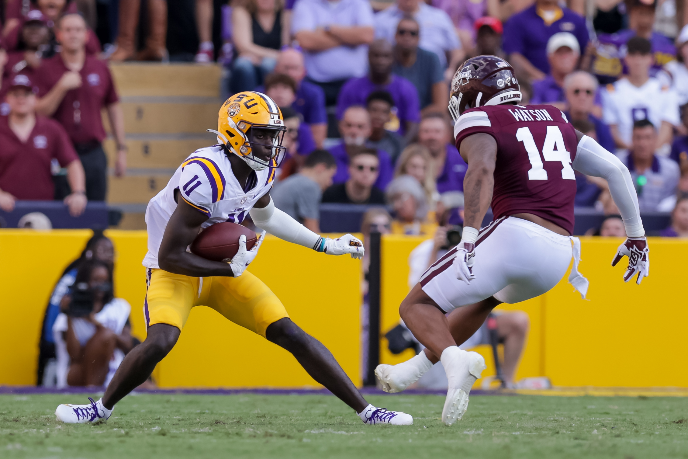 Sep 17, 2022; Baton Rouge, Louisiana, USA; LSU Tigers wide receiver Brian Thomas Jr. (11) runs against Mississippi State Bulldogs linebacker Nathaniel Watson (14) during the first half at Tiger Stadium.