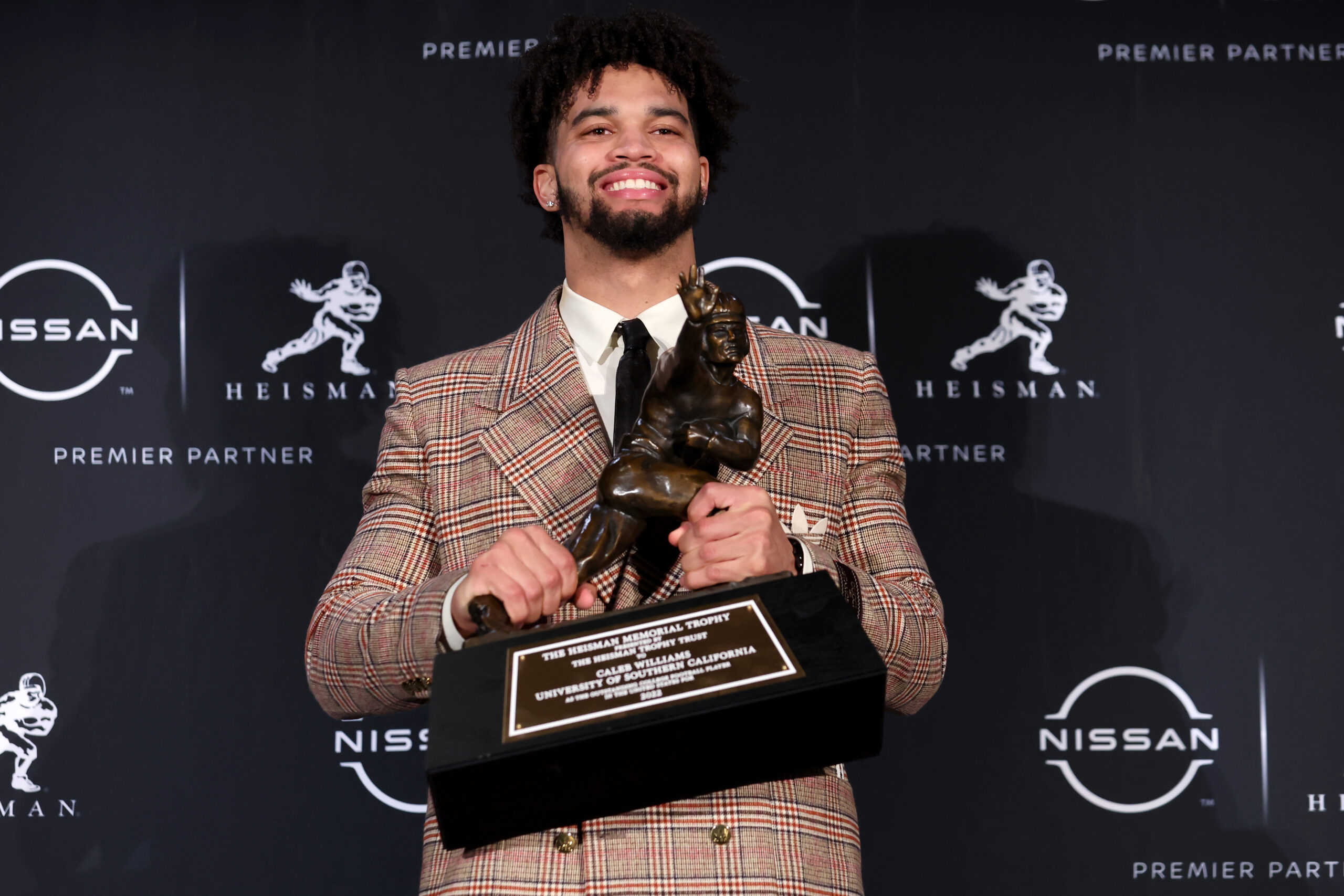 Dec 10, 2022; New York, NY, USA; Southern California quarterback Caleb Williams poses for photos during a press conference in the Astor Ballroom at the New York Marriott Marquis in New York, NY, after winning the 2022 Heisman Trophy.