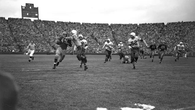 Bob Chappuis (49) is pictured against Ohio State in 1947.