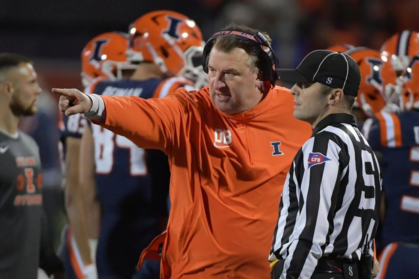 Oct 6, 2023; Champaign, Illinois, USA; Illinois Fighting Illini head coach Bret Bielema talks with an official during the first half against the Nebraska Cornhuskers at Memorial Stadium.