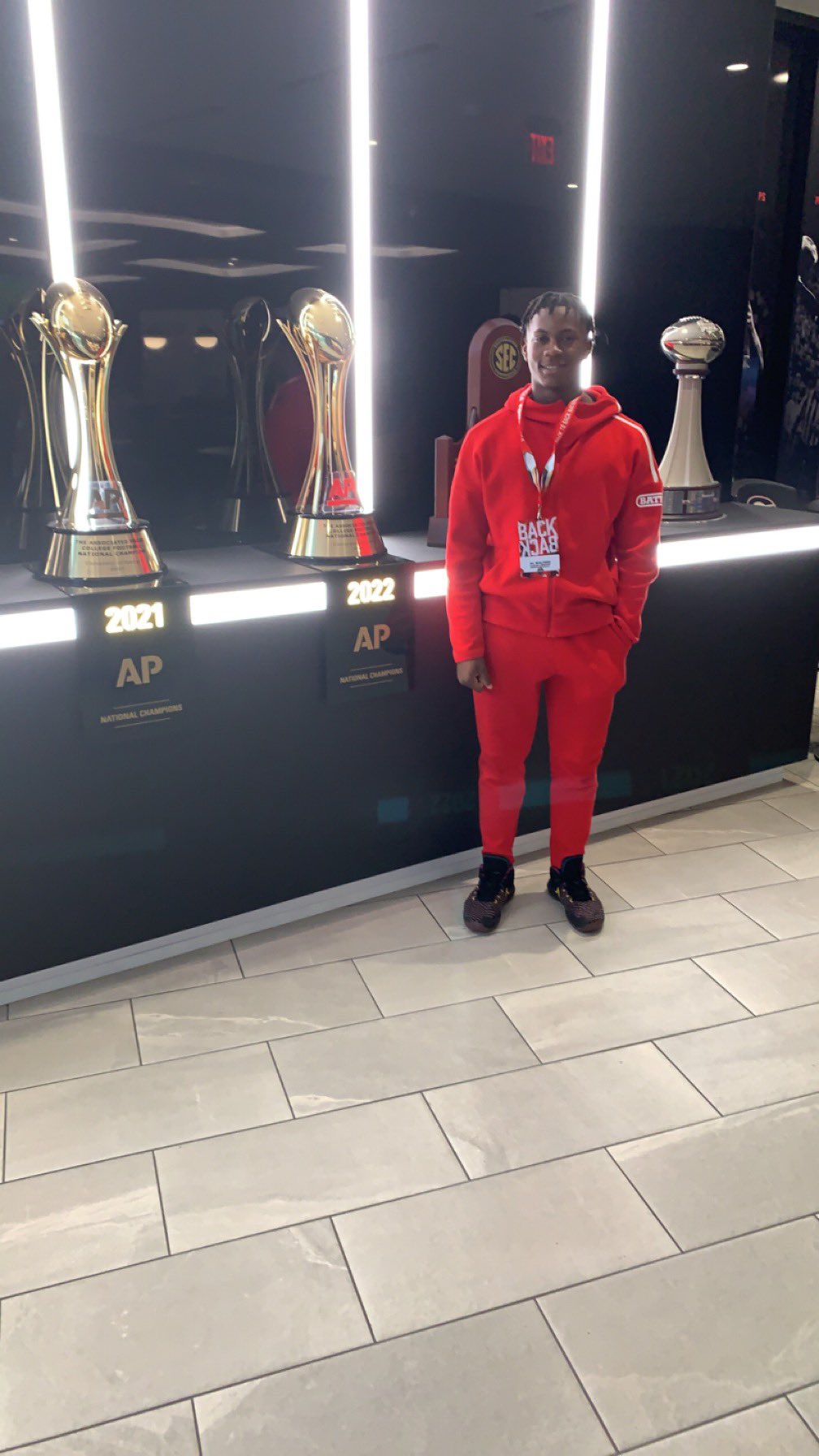 2025 3-star RB AC Walters from Montgomery, Alabama (Alabama Christian Academy) stands in front of trophies on a visit to Georgia