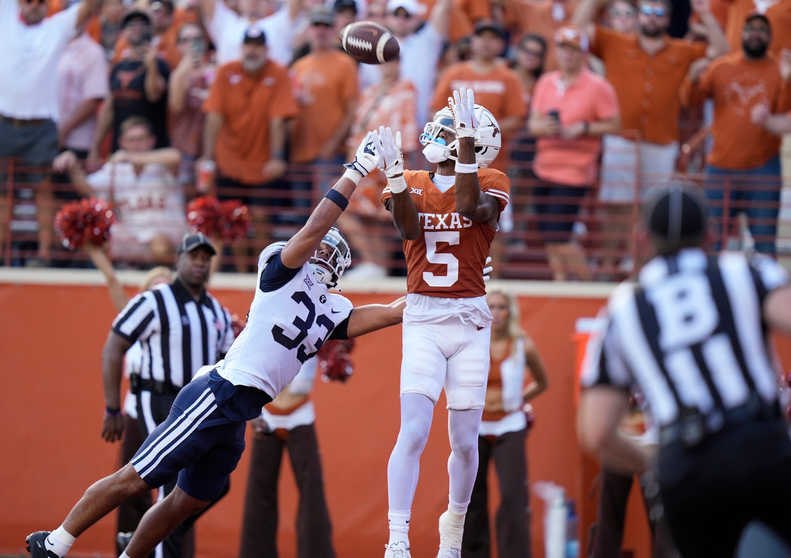 Texas Longhorns wide receiver Adonai Mitchell catches a touchdown pass in the second quarter against BYU Cougars safety Raider Damuni at Royal-Memorial Stadium on Saturday October 28, 2023.
