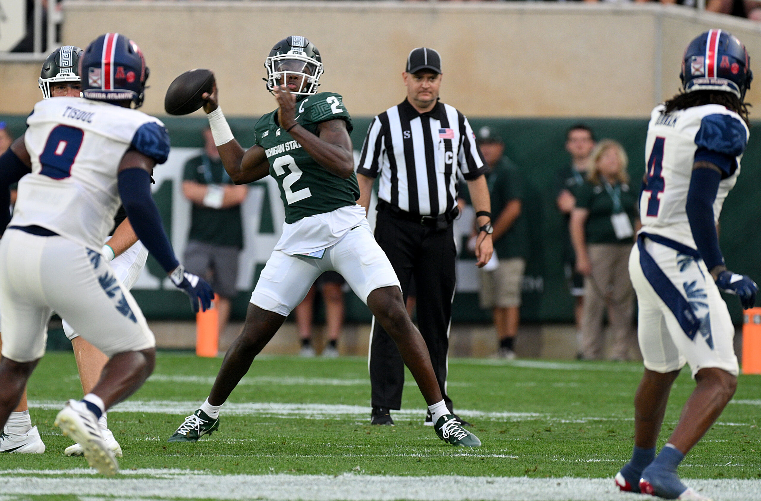 Aug 30, 2024; East Lansing, Michigan, USA; Michigan State Spartans quarterback Aidan Chiles (2) throws a first down in the first quarter against the Florida Atlantic Owls at Spartan Stadium.