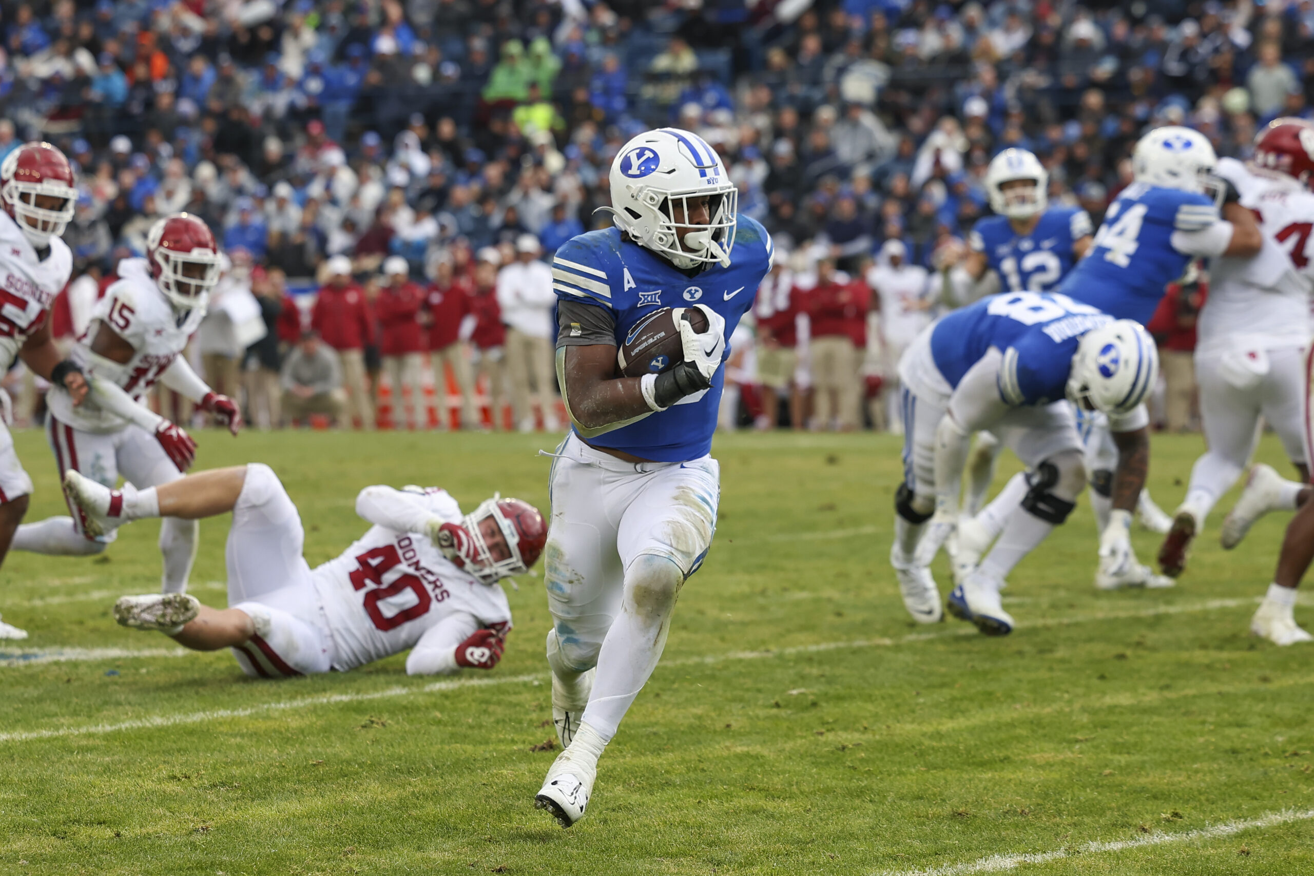 Nov 18, 2023; Provo, Utah, USA; Brigham Young Cougars running back Aidan Robbins (3) runs the ball against the Oklahoma Sooners in the third quarter at LaVell Edwards Stadium.