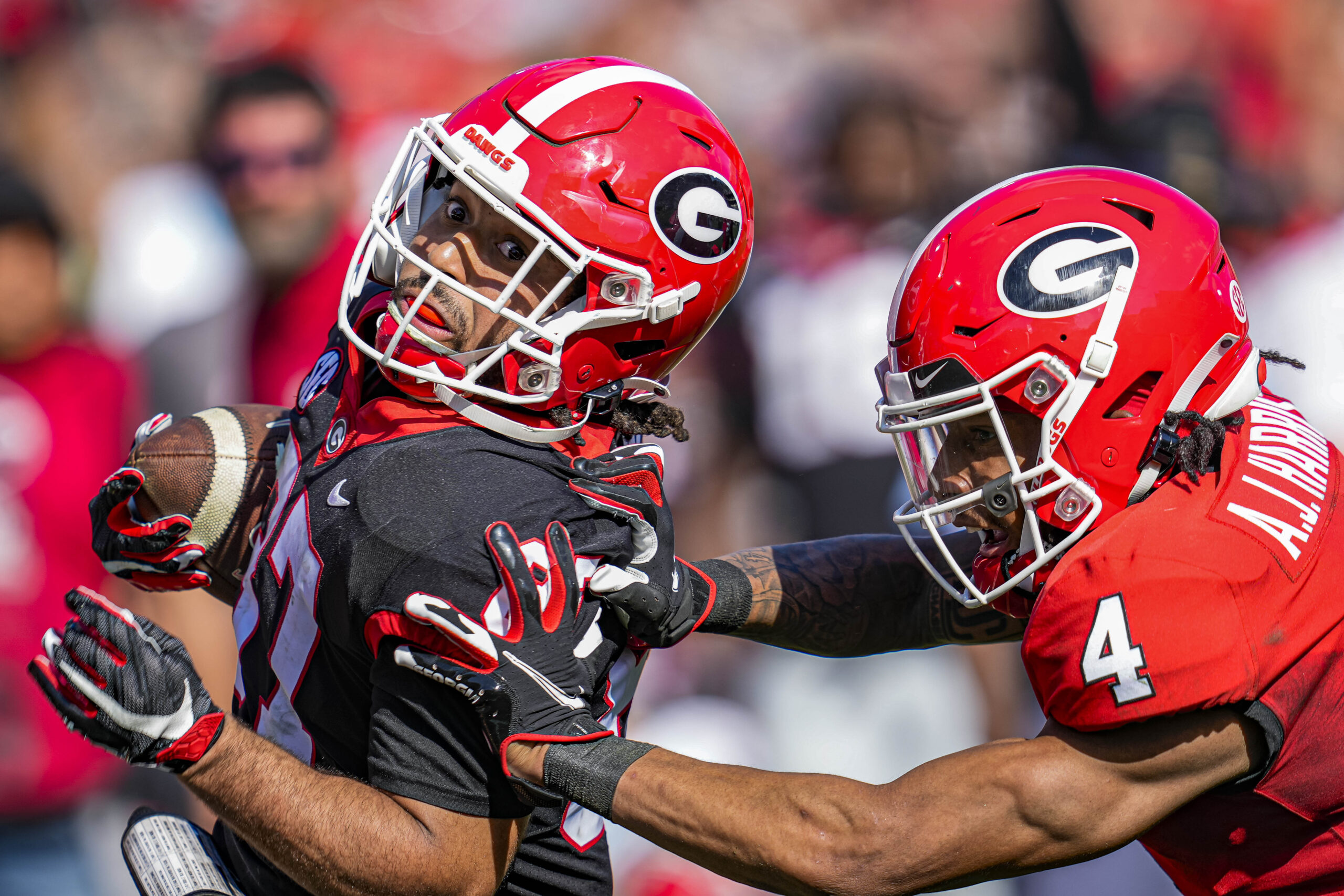 Apr 15, 2023; Athens, GA, USA; Georgia Bulldogs wide receiver Mekhi Mews (87) gets shoved out of bounds by defensive back A.J. Harris (4) during the Georgia Spring Game at Sanford Stadium.