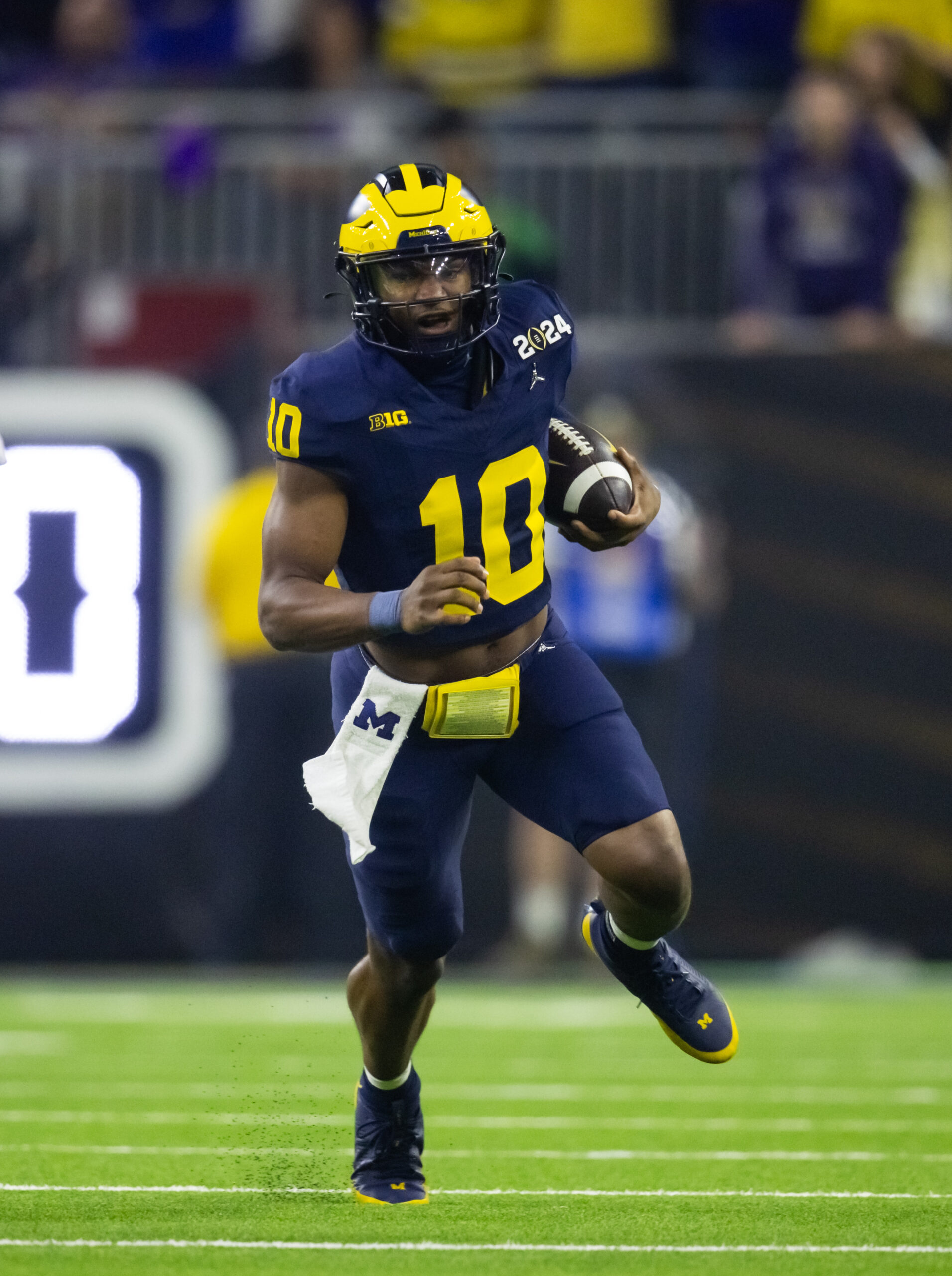 Jan 8, 2024; Houston, TX, USA; Michigan Wolverines quarterback Alex Orji (10) against the Washington Huskies during the 2024 College Football Playoff national championship game at NRG Stadium.