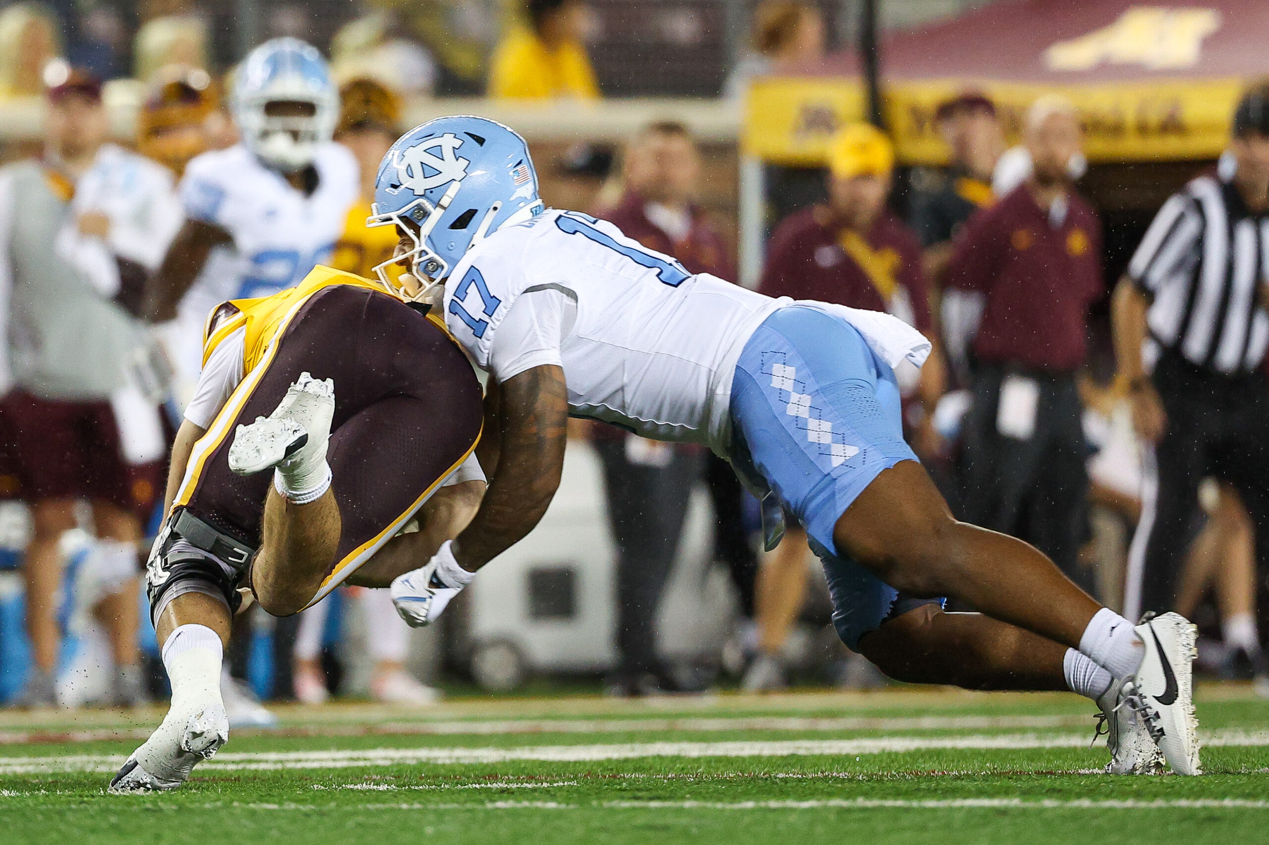 Aug 29, 2024; Minneapolis, Minnesota, USA; North Carolina Tar Heels linebacker Amare Campbell (17) forces a fumble on Minnesota Golden Gophers quarterback Max Brosmer (16) during the second half at Huntington Bank Stadium.