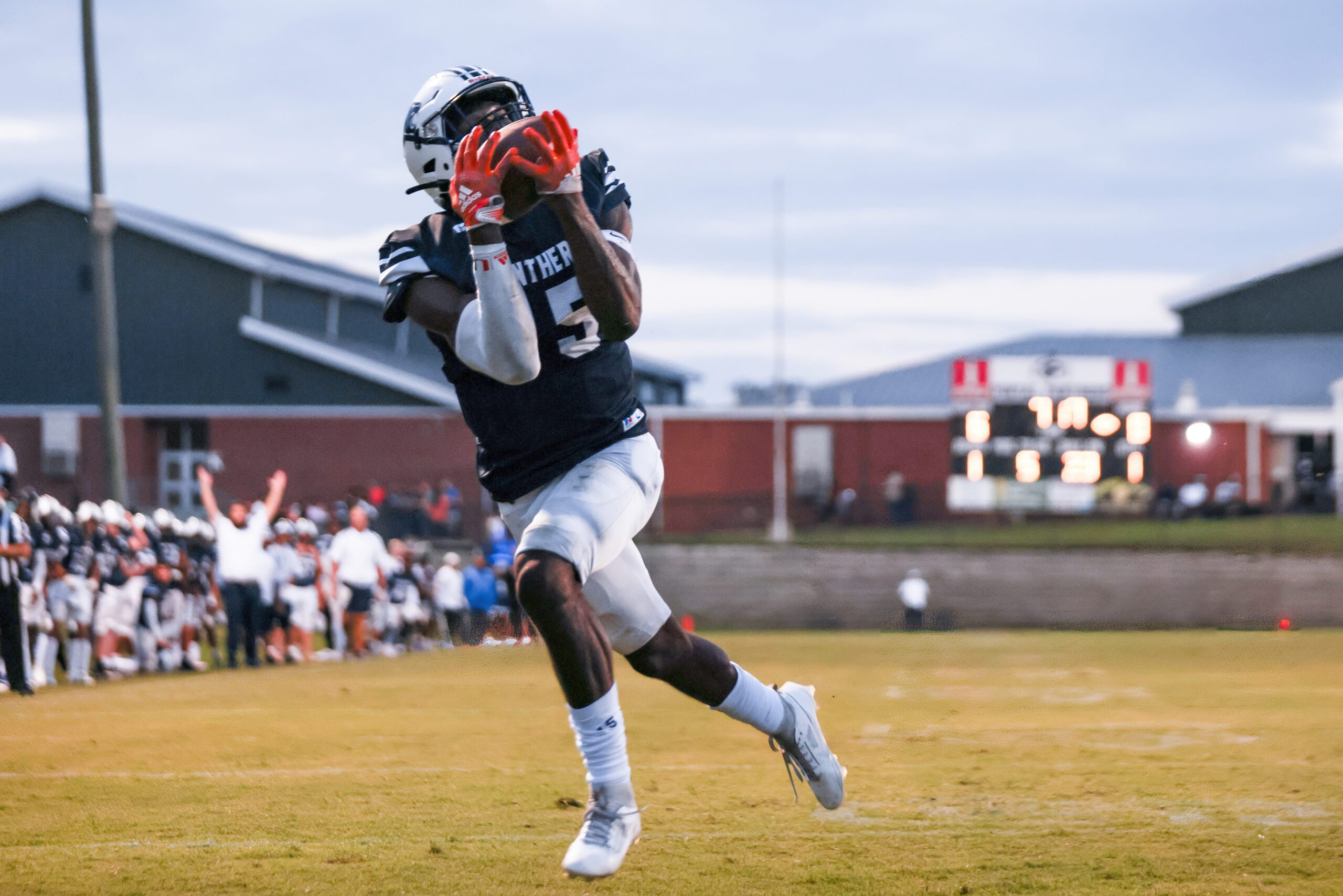 Panthers tight end #15 Amir Jackson catches a deep pass and scores the first touchdown of the Friday night game between The Bryan County Redskins and the Portal Panthers in Portal, GA.