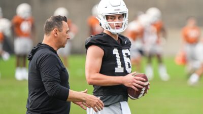 Texas head coach Steve Sarkisian talks to quarterback Arch Manning (16) during the first Texas Longhorns football practice of 2023 at the Frank Denius Fields on the University of Texas at Austin campus on Monday