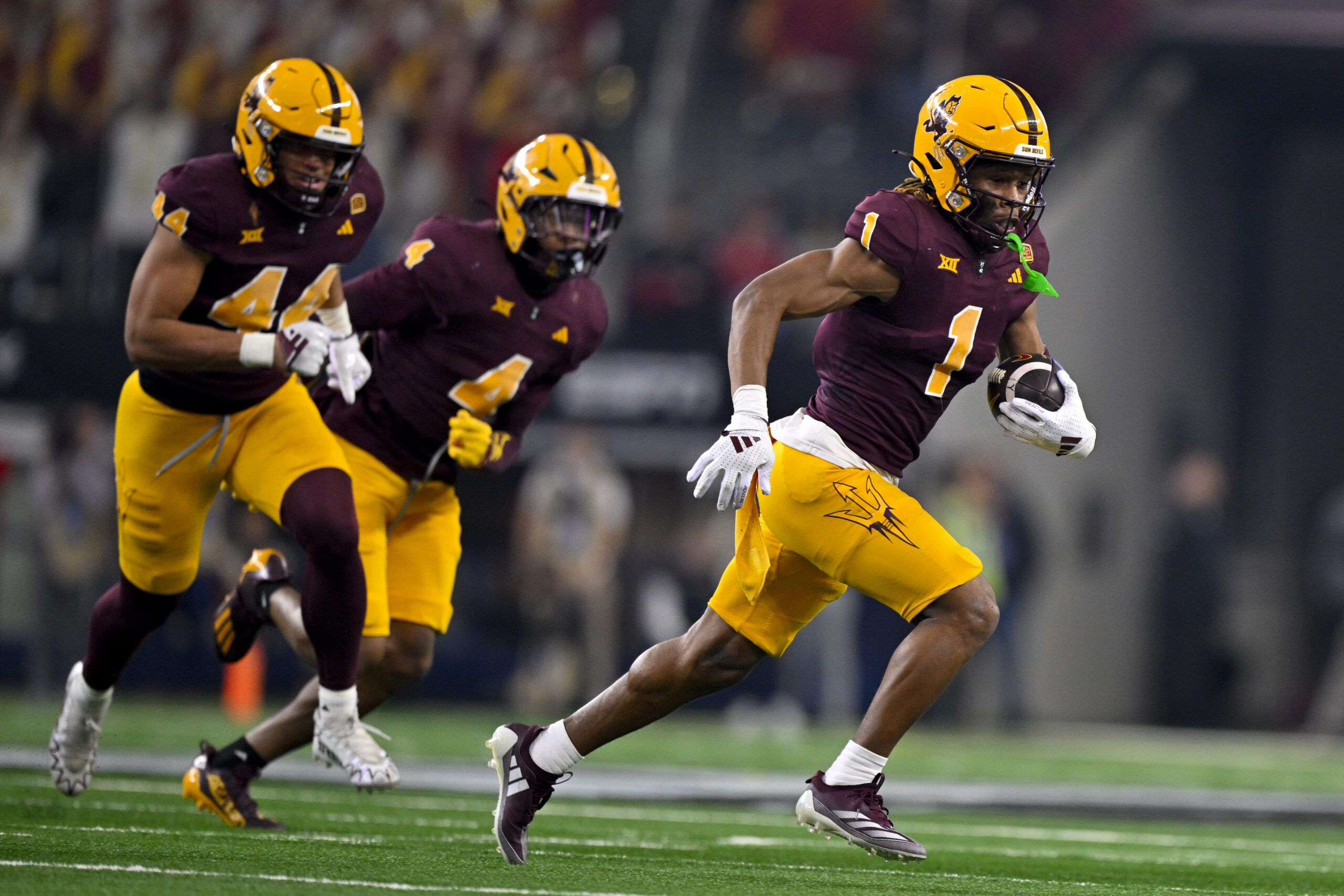 Dec 7, 2024; Arlington, TX, USA; Arizona State Sun Devils linebacker Keyshaun Elliott (44) and defensive back Myles Rowser (4) and defensive back Keith Abney II (1) in action during the game between the Iowa State Cyclones and the Arizona State Sun Devils at AT&T Stadium.