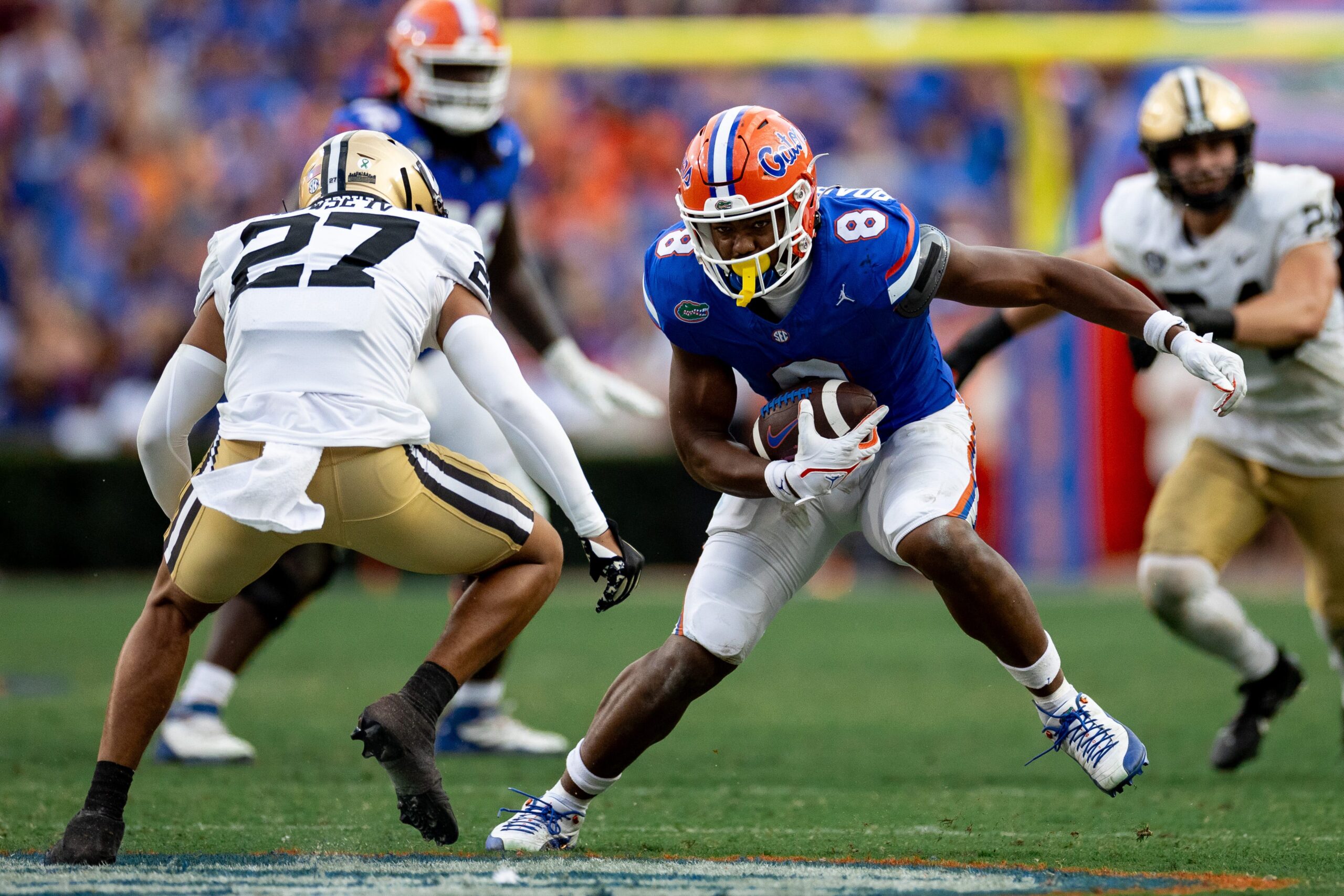 Caption: Florida Gators tight end Arlis Boardingham (8) runs with the ball after a catch against Vanderbilt Commodores safety John Howse IV (27) during the second half at Steve Spurrier Field at Ben Hill Griffin Stadium in Gainesville, FL on Saturday, October 7, 2023.