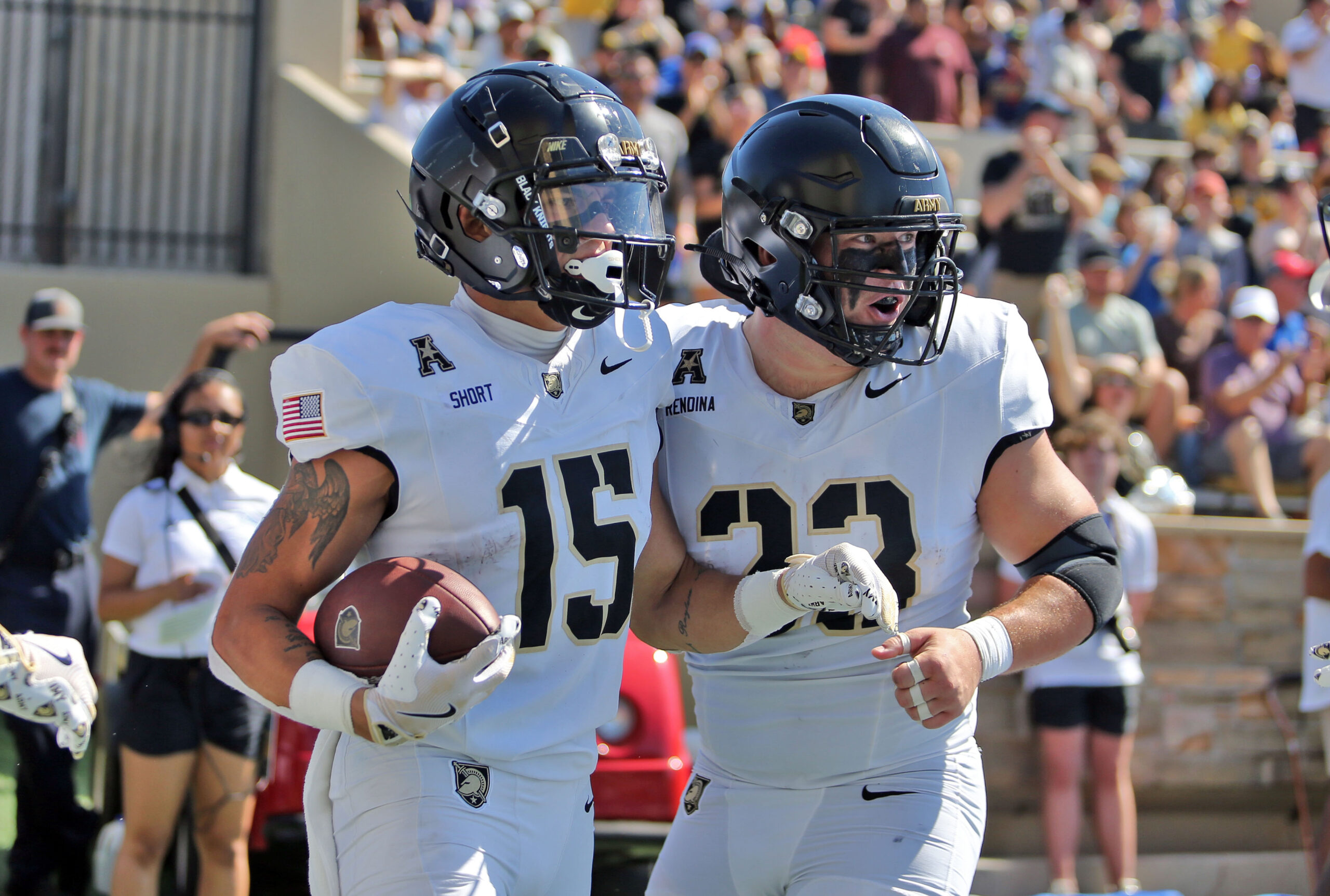 Oct 5, 2024; Tulsa, Oklahoma, USA; Army Black Knights running back Noah Short (15) celebrates his touchdown catch with running back Jake Rendina (33) during the first half against the Tulsa Golden Hurricane at Skelly Field at H.A. Chapman Stadium.