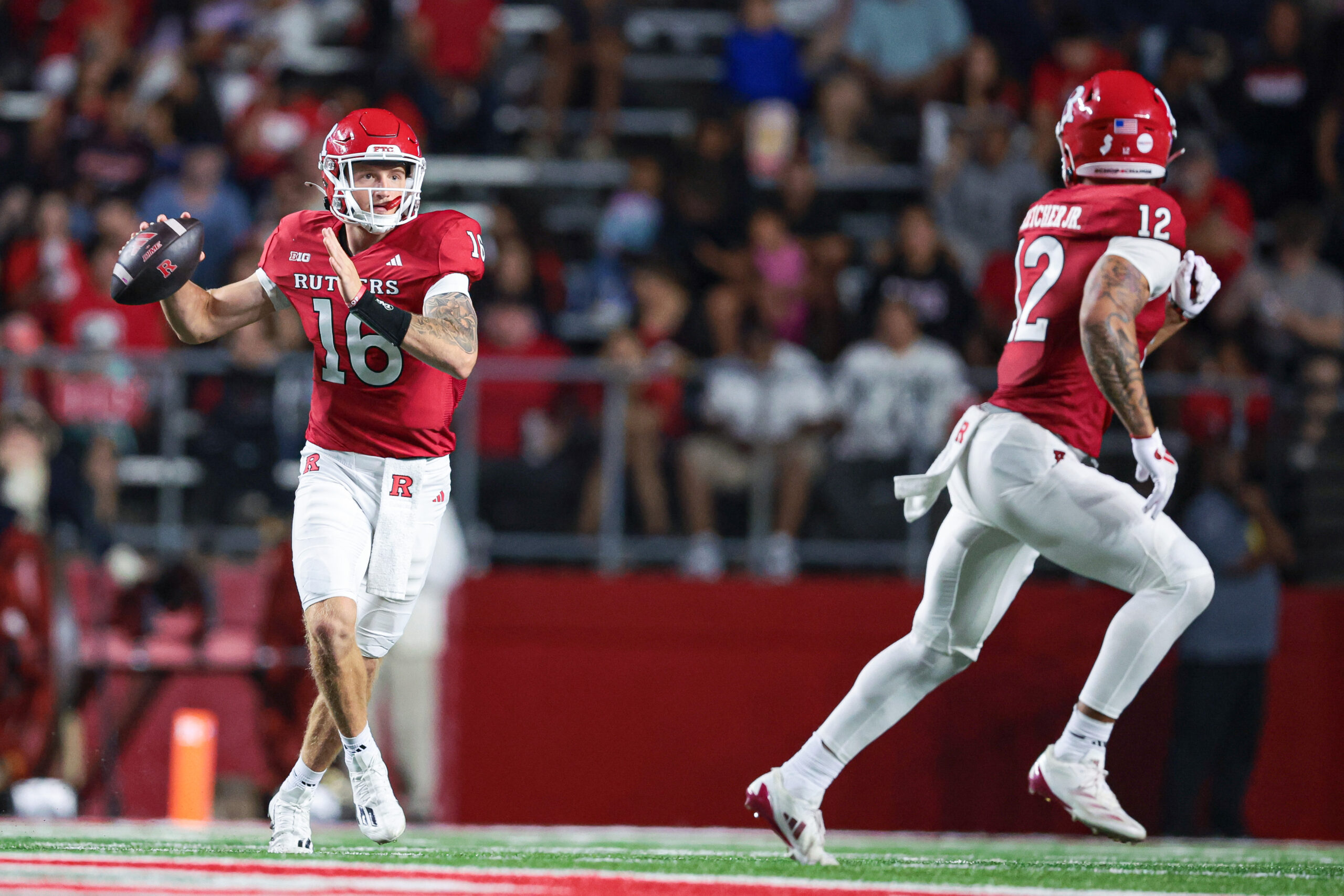 Aug 29, 2024; Piscataway, New Jersey, USA; Rutgers Scarlet Knights quarterback Athan Kaliakmanis (16) looks to pass to tight end Kenny Fletcher (12) during the second half against the Howard Bison at SHI Stadium.