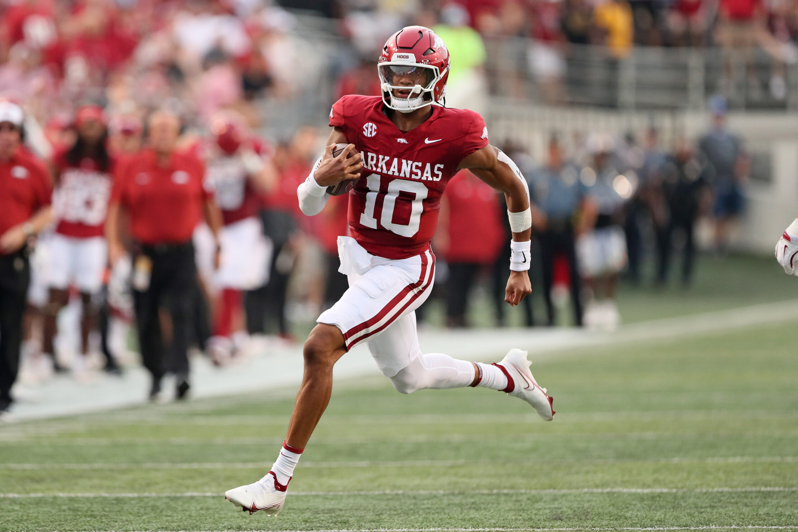Aug 29, 2024; Little Rock, Arkansas, USA; Arkansas Razorbacks quarterback Taylen Green (10) rushes during the first quarter against the Pine Bluff Golden Lions at War Memorial Stadium.