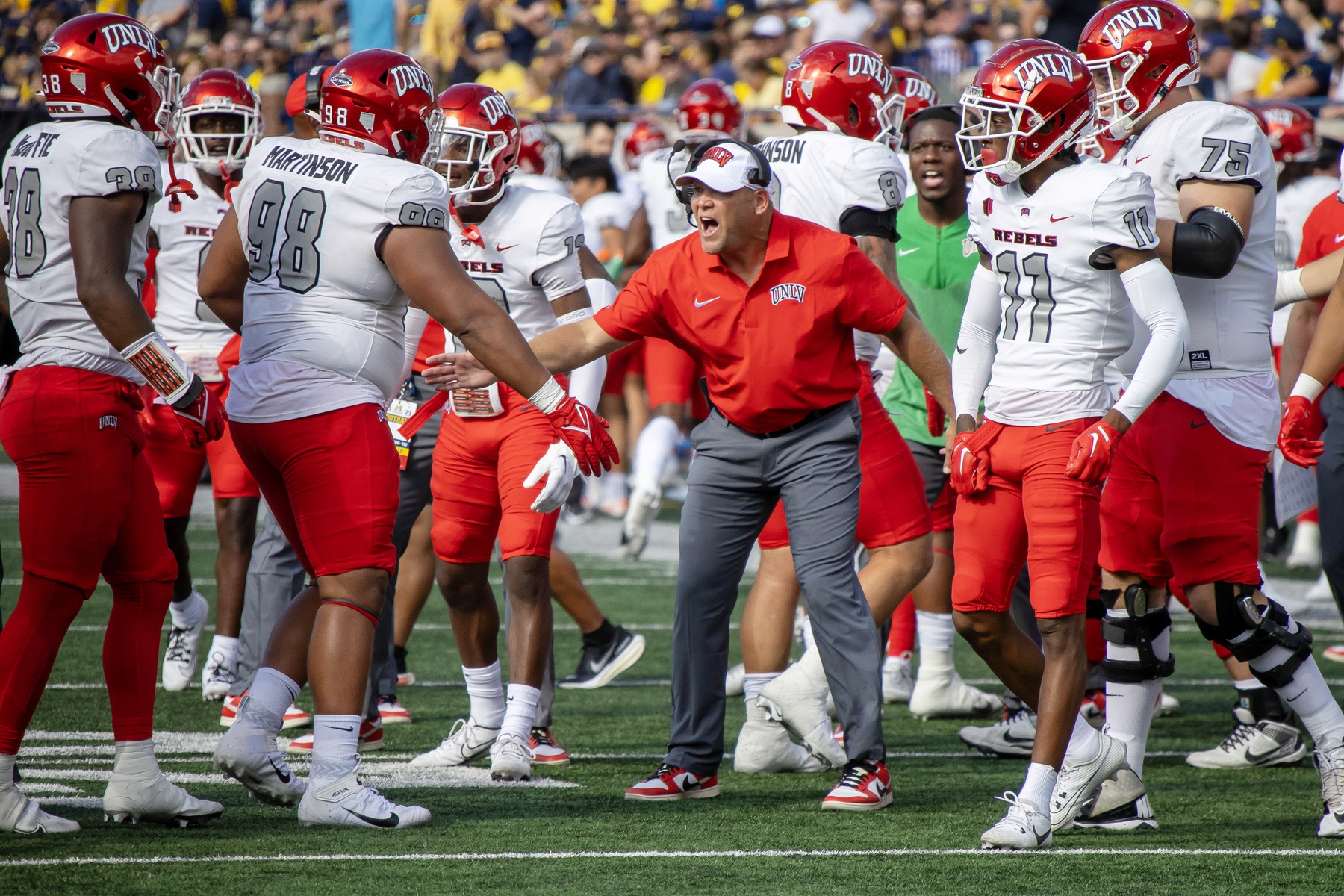 Sep 9, 2023; Ann Arbor, Michigan, USA; UNLV Rebels head coach Head coach Barry Odom is pumped after his team stopped Michigan Wolverines on a fourth down play during the first half at Michigan Stadium.