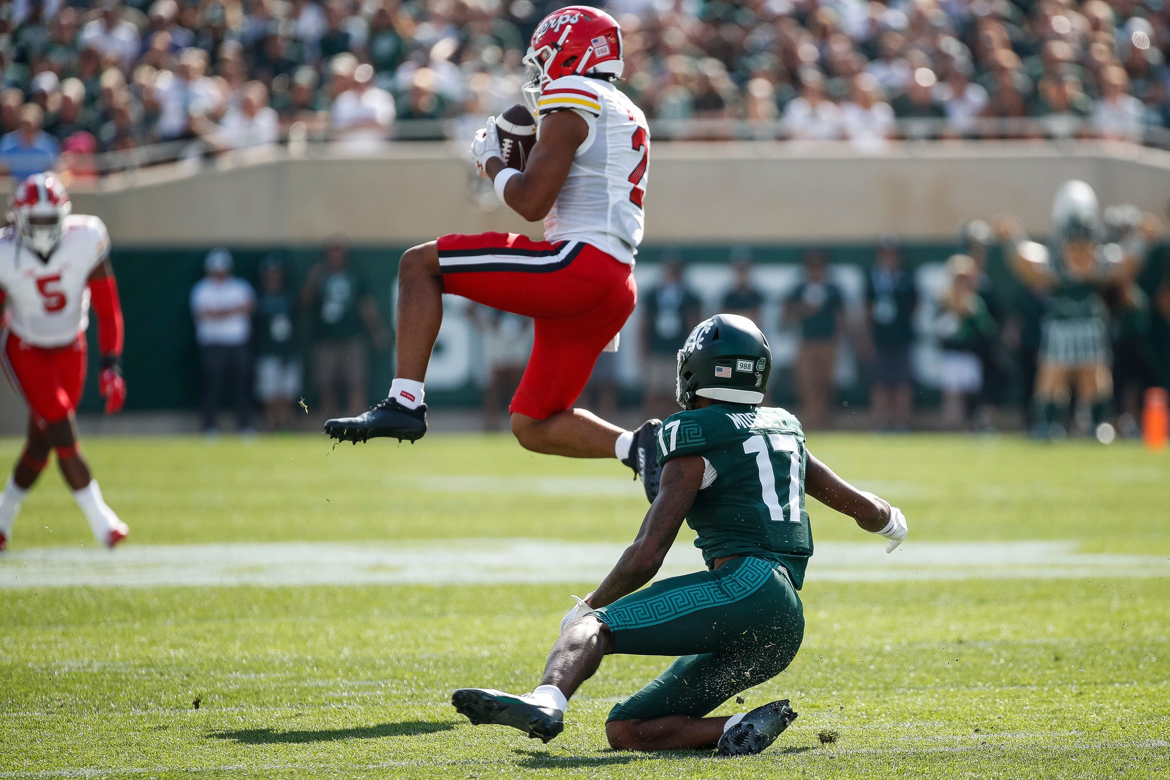 Maryland defensive back Beau Brade (2) intercepts a pass intended for Michigan State wide receiver Tre Mosley (17) during the first half at Spartan Stadium in East Lansing on Saturday, Sept. 23, 2023.