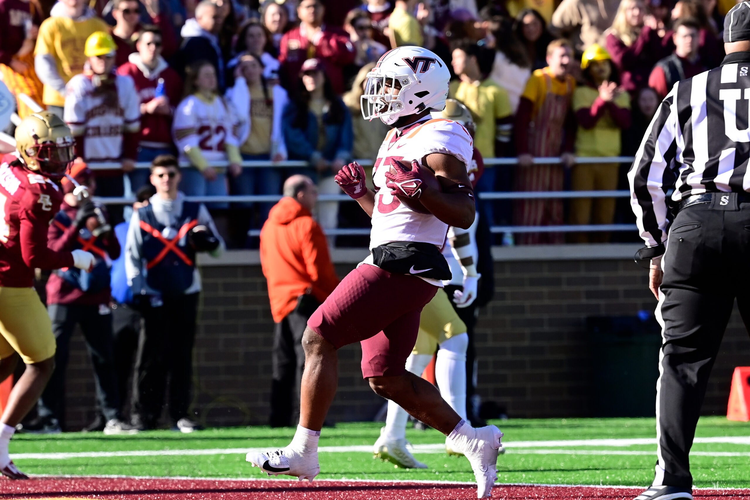 Nov 11, 2023; Chestnut Hill, Massachusetts, USA; Virginia Tech Hokies running back Bhayshul Tuten (33) scores a touchdown during the first half against the Boston College Eagles at Alumni Stadium.