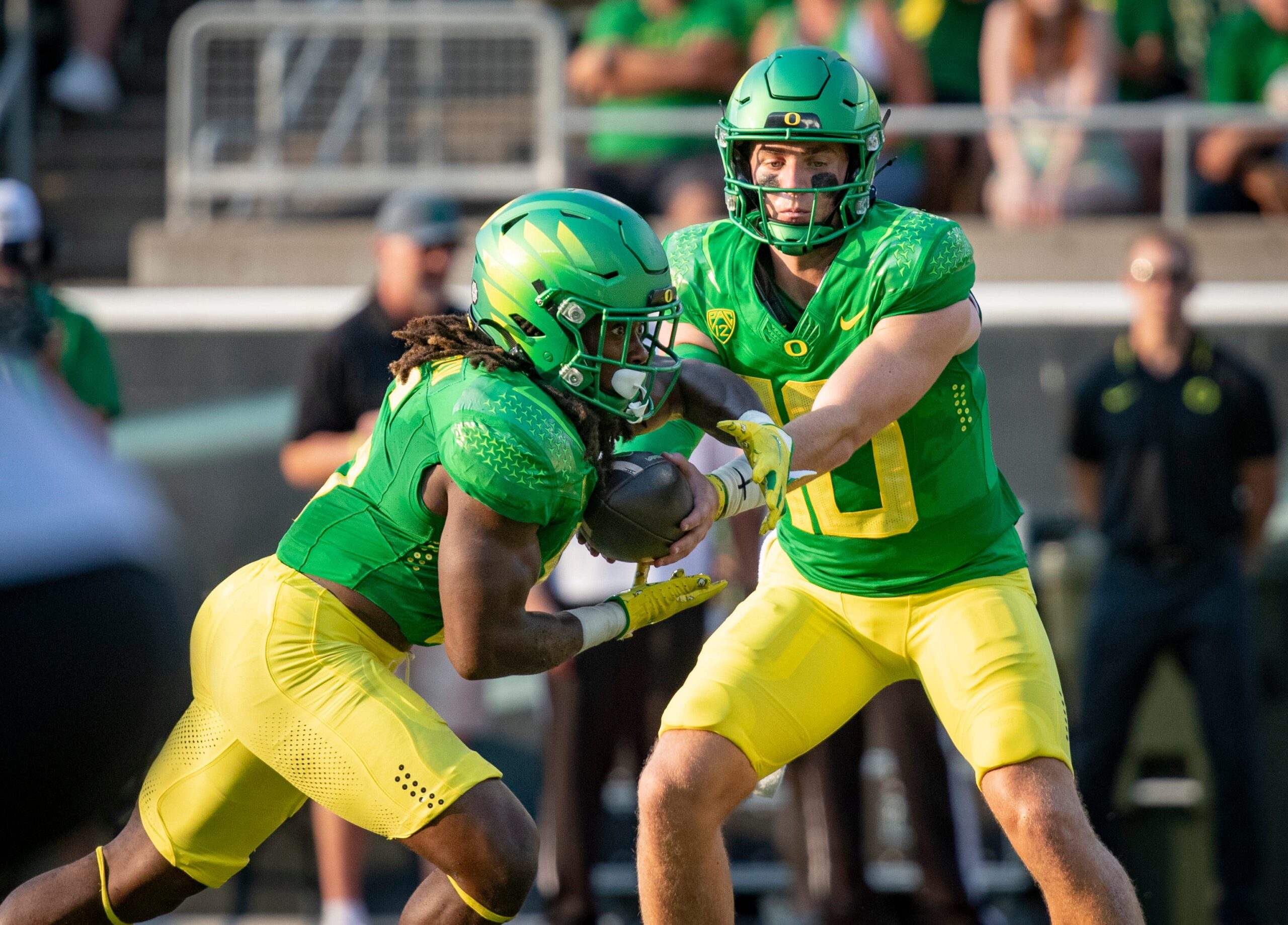 Oregon quarterback Bo Nix hands off the ball to running back Noah Whittington as the Oregon Ducks host Hawaii Saturday, Sept. 16, 2023, at Hayward Field in Eugene, Ore.