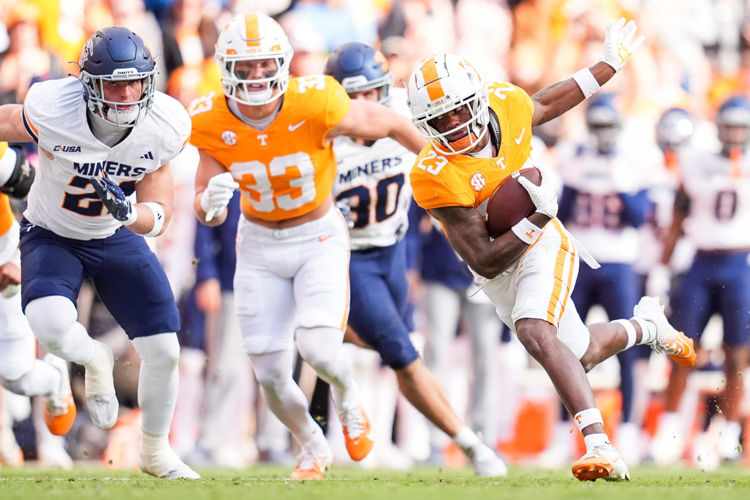 Nov 23, 2024; Knoxville, Tennessee, USA; Tennessee Volunteers defensive back Boo Carter (23) returns a punt against the UTEP Miners during the first half at Neyland Stadium. 