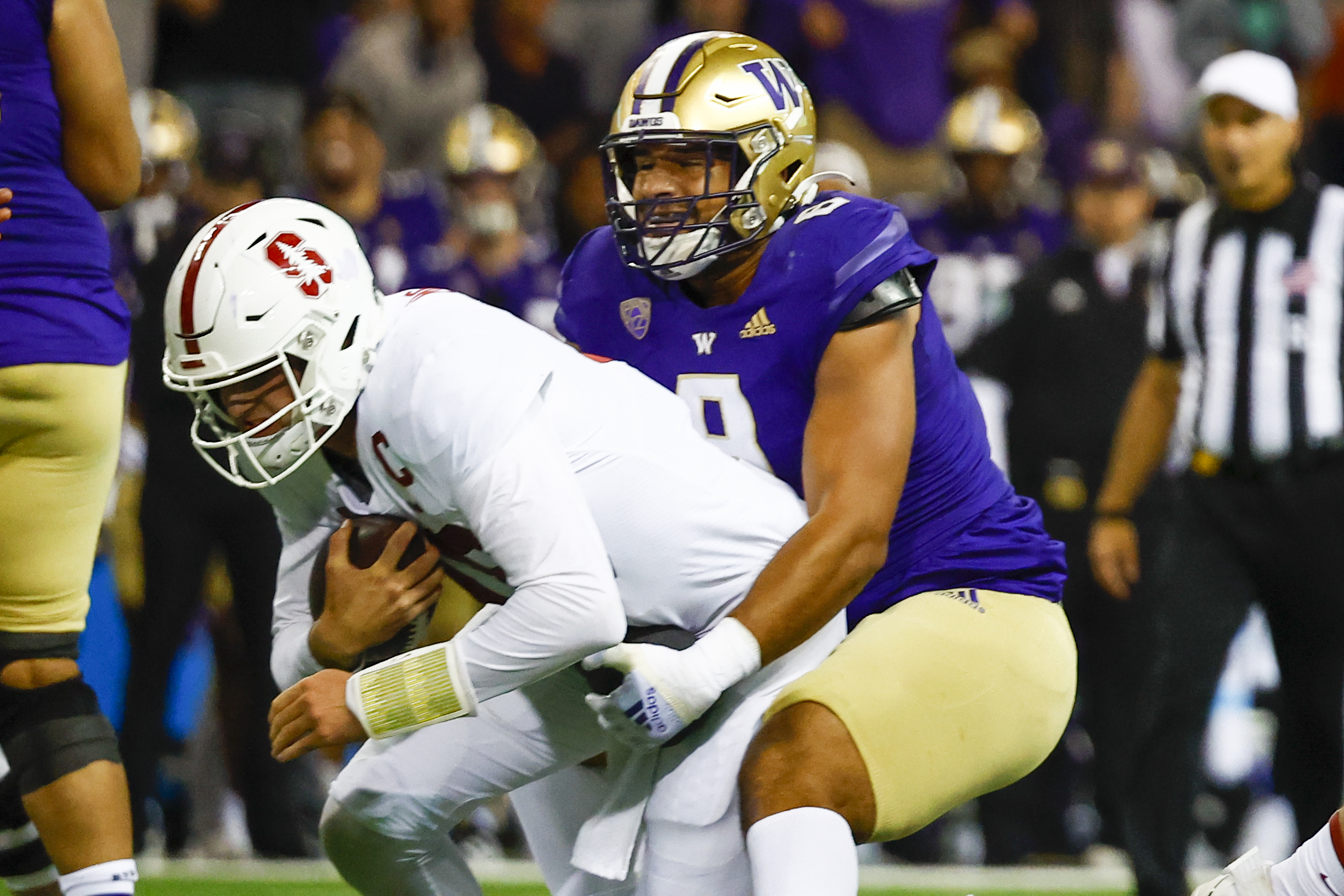 Sep 24, 2022; Seattle, Washington, USA; Washington Huskies defensive lineman Bralen Trice (8) sacks Stanford Cardinal quarterback Tanner McKee (18) during the first quarter at Alaska Airlines Field at Husky Stadium.