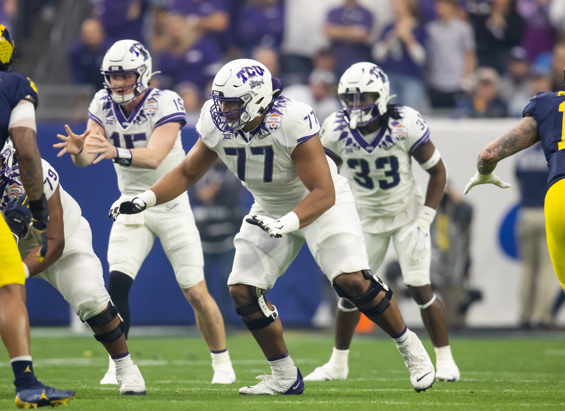 Dec 31, 2022; Glendale, Arizona, USA; TCU Horned Frogs offensive lineman Brandon Coleman (77) against the Michigan Wolverines during the 2022 Fiesta Bowl at State Farm Stadium.