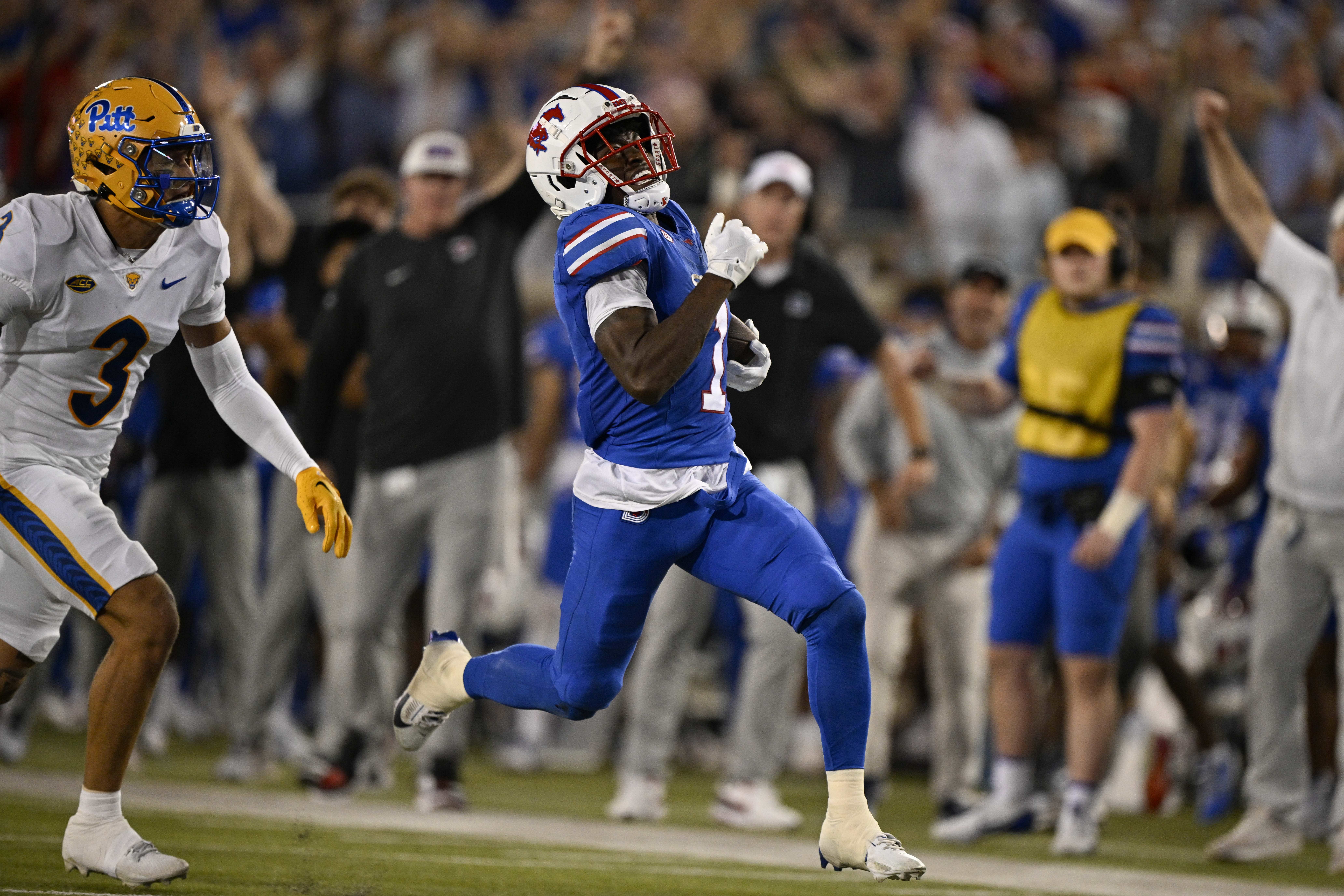 Sep 28, 2024; Dallas, Texas, USA; Southern Methodist Mustangs running back Brashard Smith (1) celebrates after he catches a pass against Florida State Seminoles defensive back Shyheim Brown (1) and defensive back Conrad Hussey (12) during the second half at Gerald J. Ford Stadium