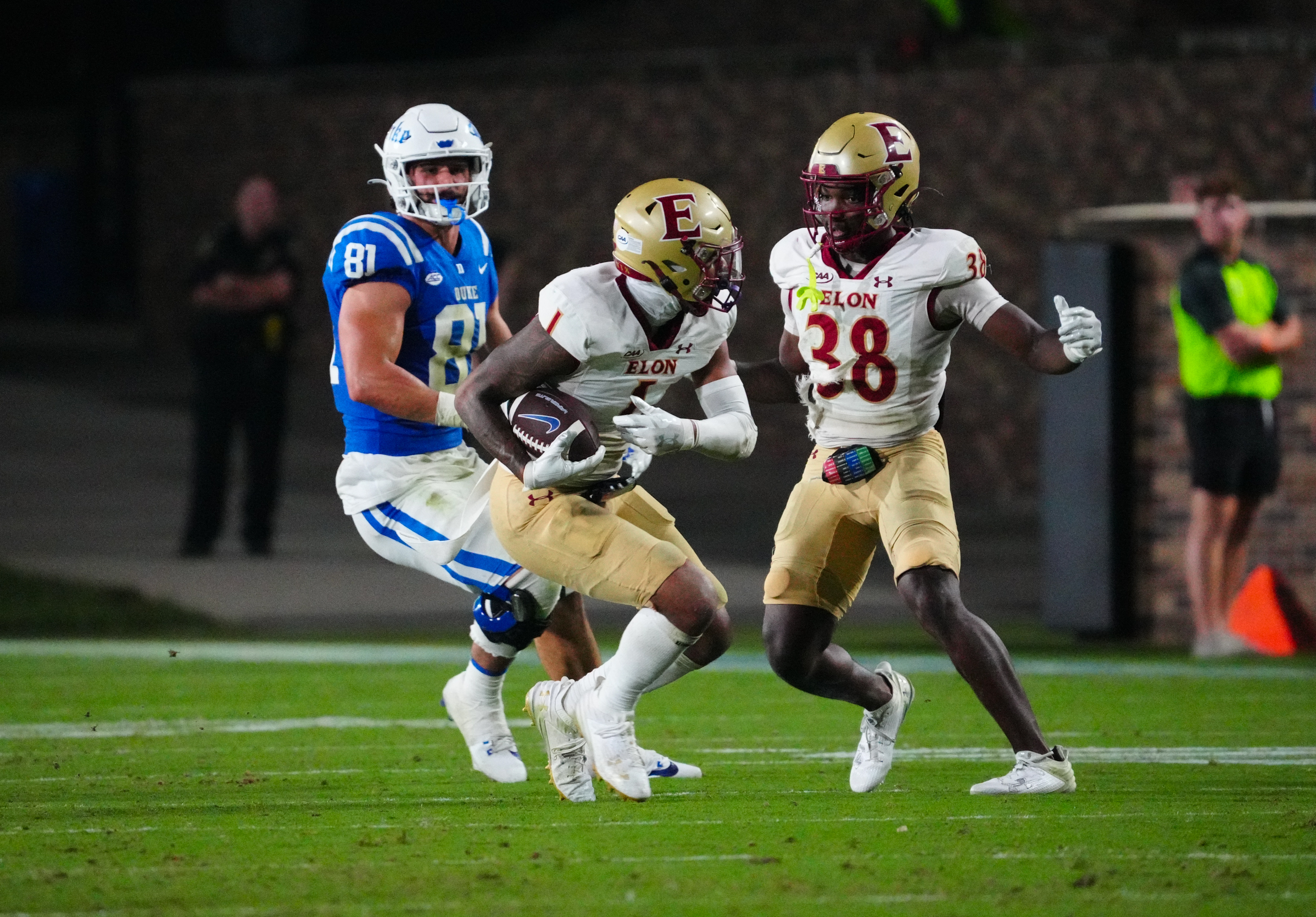 Aug 30, 2024; Durham, North Carolina, USA; Elon Phoenix defensive back Caleb Curtain (1) makes an interception against Duke Blue Devils tight end Nicky Dalmolin (81) during the second half at Wallace Wade Stadium.