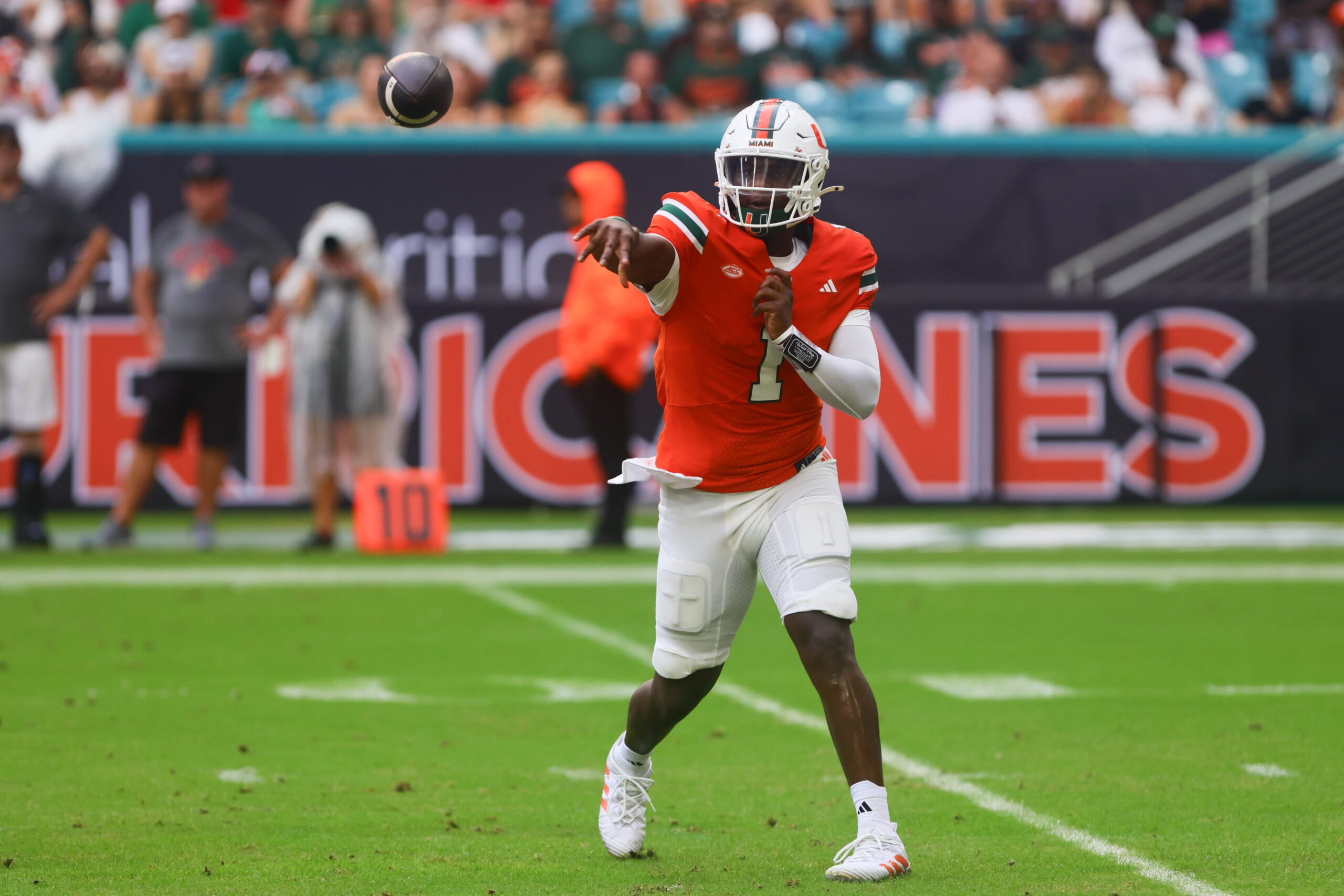Sep 7, 2024; Miami Gardens, Florida, USA; Miami Hurricanes quarterback Cam Ward (1) drops back to pass against the Florida A&M Rattlers during the third quarter at Hard Rock Stadium. 