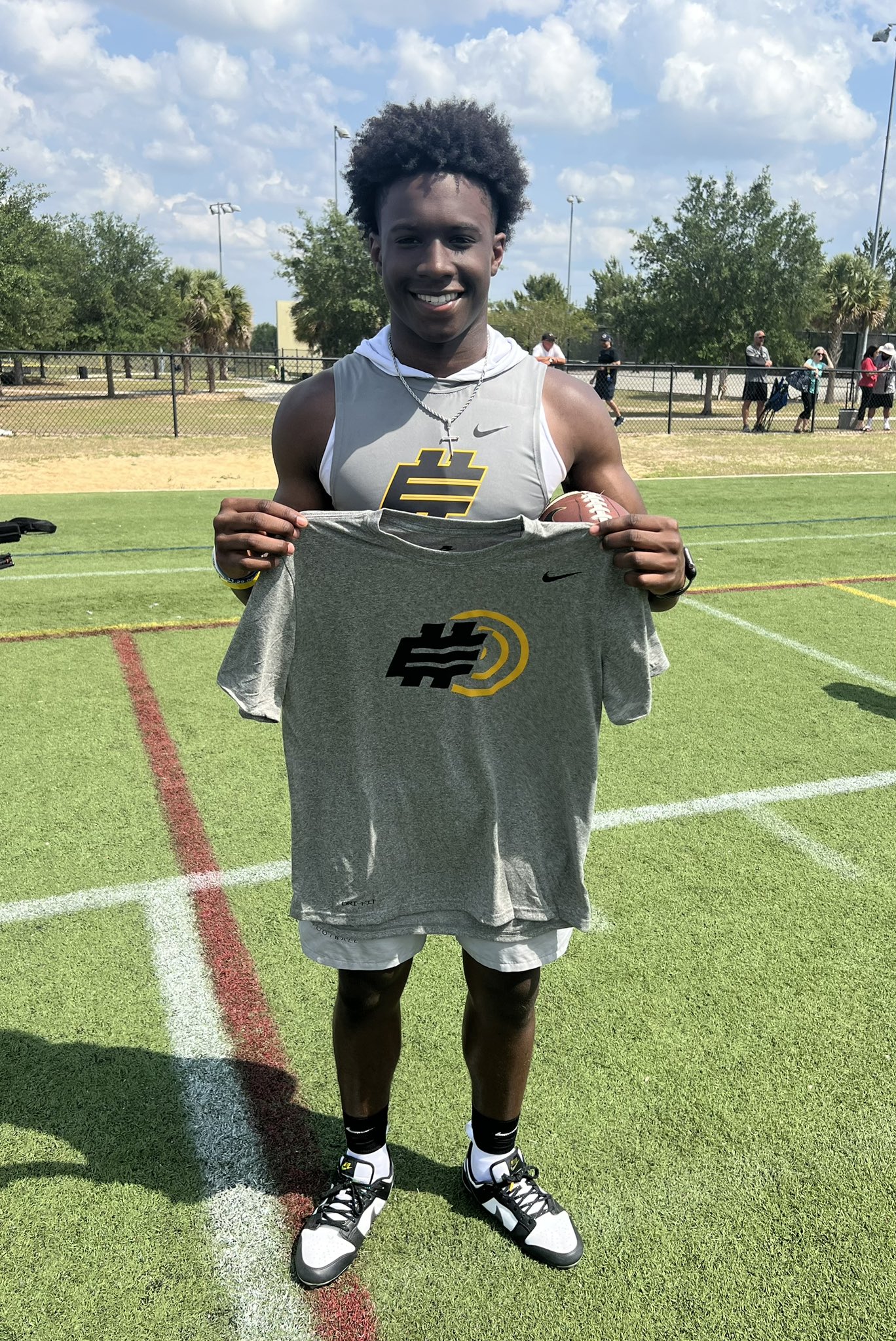 2025 3-Star QB Carson Boyd from East Saint Louis, MO (Cardinal Ritter College Prep) taking a picture after winning Underclassman Golden Arm at the April 2nd Elite 11 Orlando Camp
