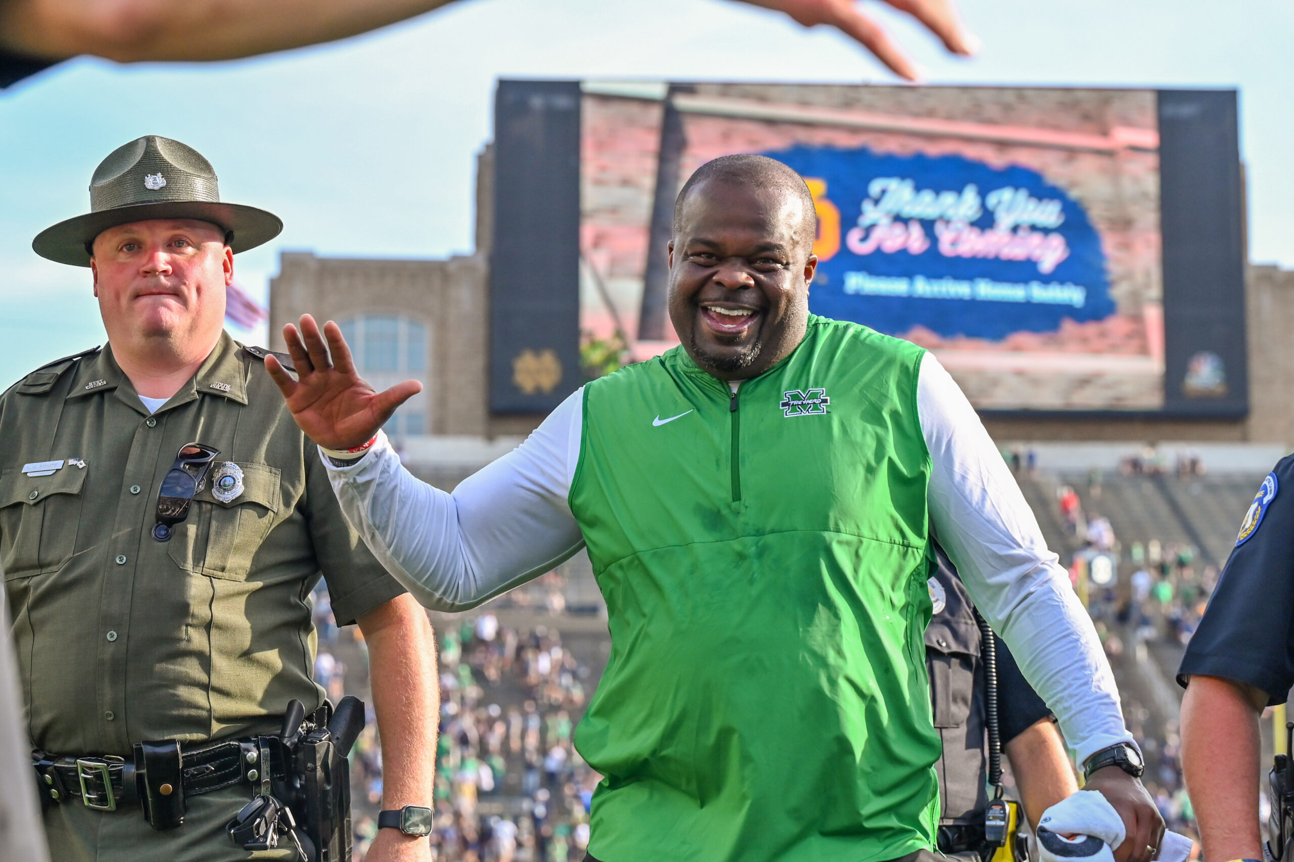 Sep 10, 2022; South Bend, Indiana, USA; Marshall Thundering Herd head coach Charles Huff celebrates as he leaves the field after the Thundering Herd beat the Notre Dame Fighting Irish 26-21 at Notre Dame Stadium.