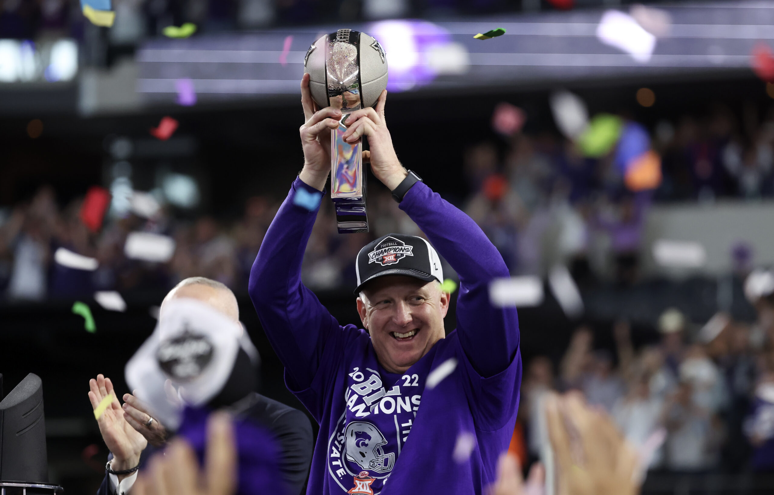 Dec 3, 2022; Arlington, TX, USA; Kansas State Wildcats head coach Chris Klieman holds up the Big 12 Championship trophy after the game against the TCU Horned Frogs at AT&T Stadium.