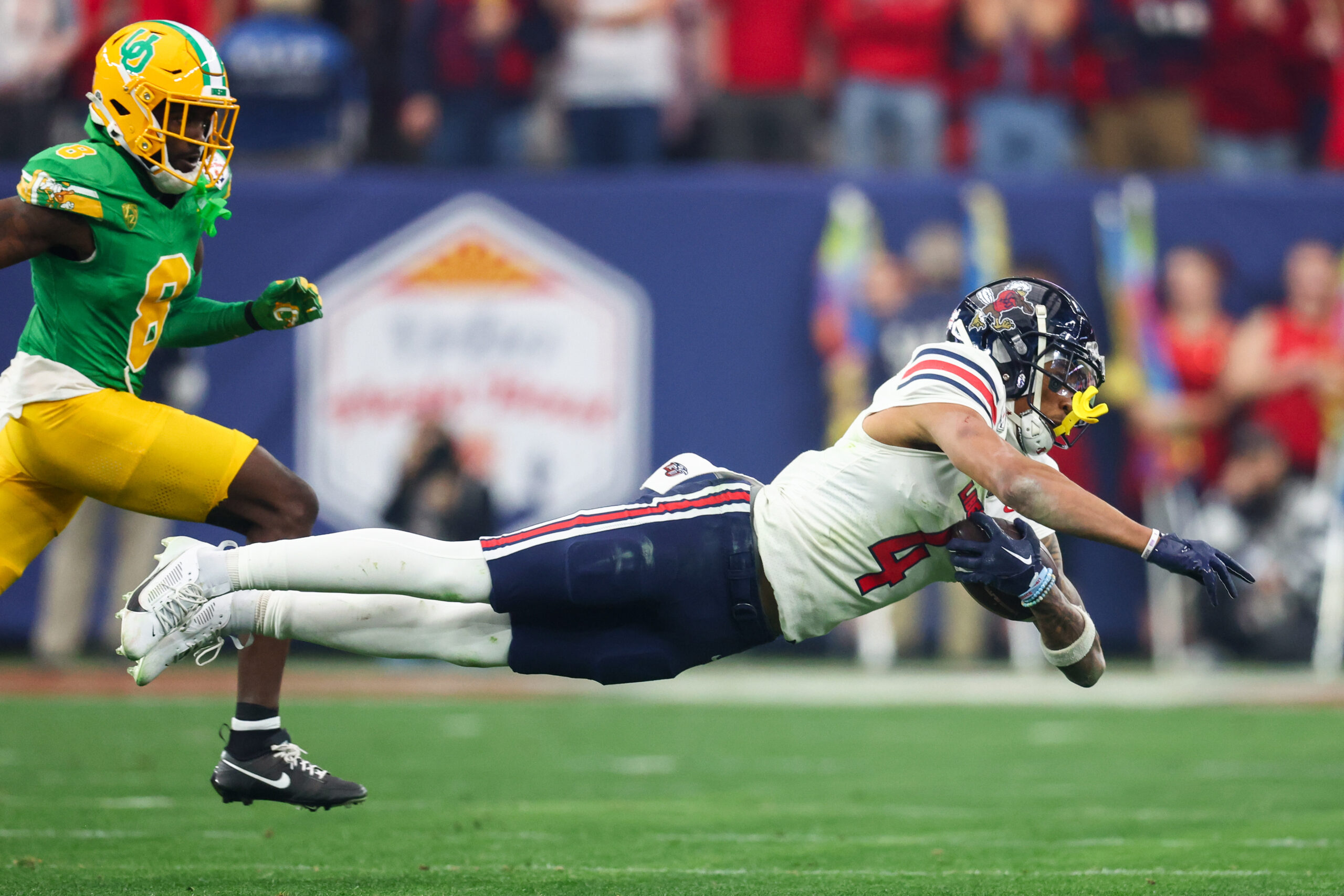 Dec 1, 2023; Lynchburg, VA, USA; Liberty Flames wide receiver CJ Daniels (4) catches a pass against the New Mexico State Aggies during the first quarter at Williams Stadium.
