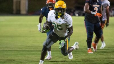 CJ Nettles (25) takes it in for a touchdown and a 12-0 Crusaders lead during the Pensacola Catholic vs Escambia football game at Escambia High School in Pensacola on Friday