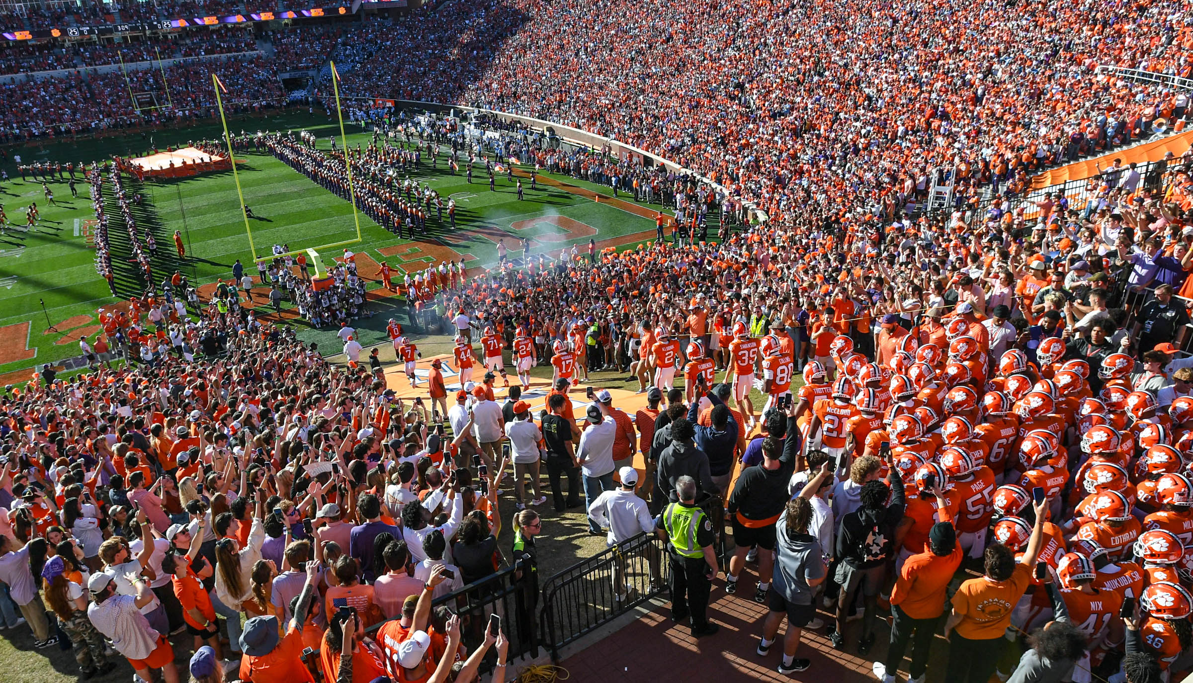 Apr 6, 2024; Clemson, South Carolina, USA; Clemson Tigers quarterback Cade Klubnik (2) and teammates run down the hill before the Clemson spring football game at Memorial Stadium.