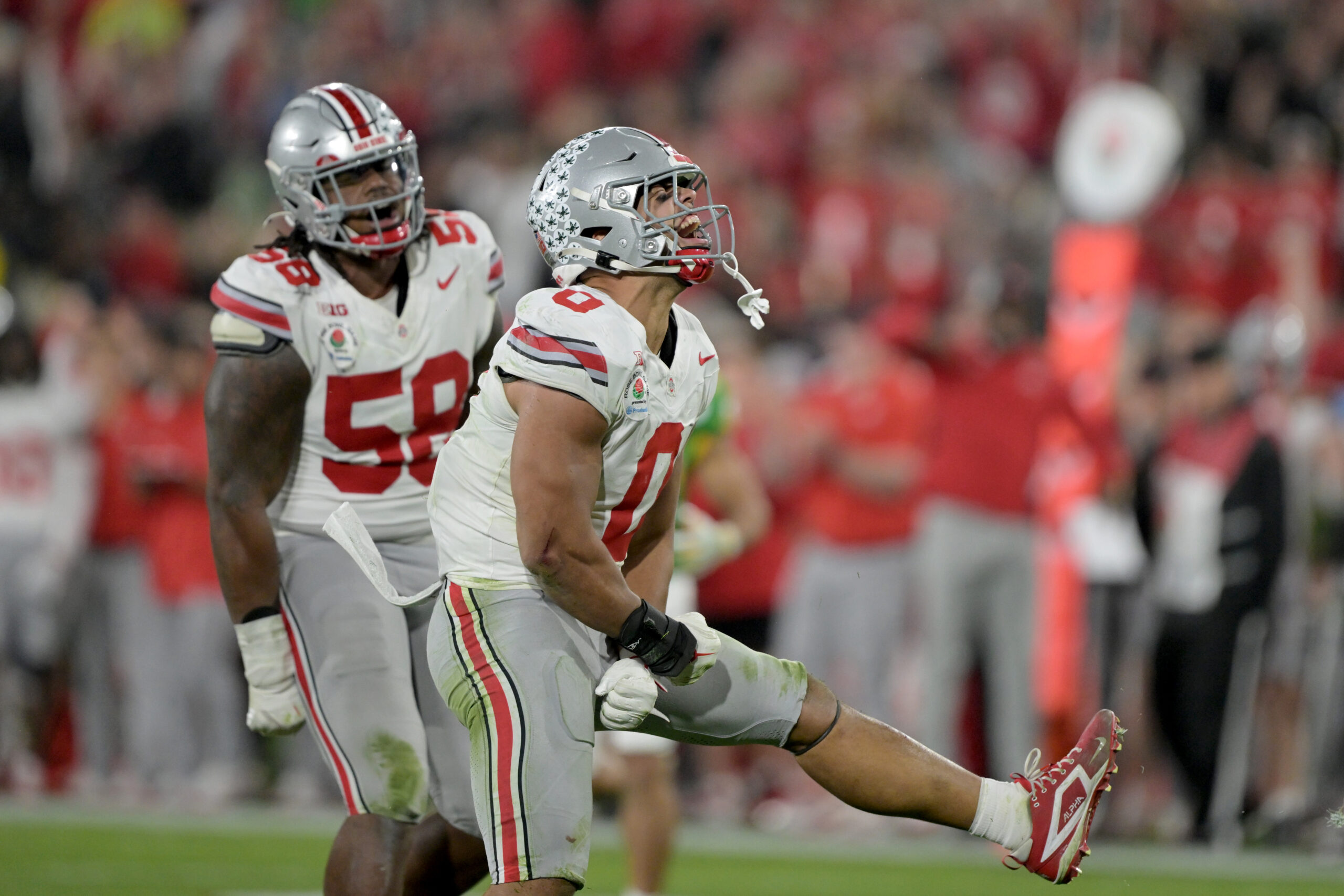 Jan 1, 2025; Pasadena, CA, USA; Ohio State Buckeyes linebacker Cody Simon (0) celebrates a sack in the second half against the Oregon Ducks in the 2025 Rose Bowl college football quarterfinal game at Rose Bowl Stadium.
