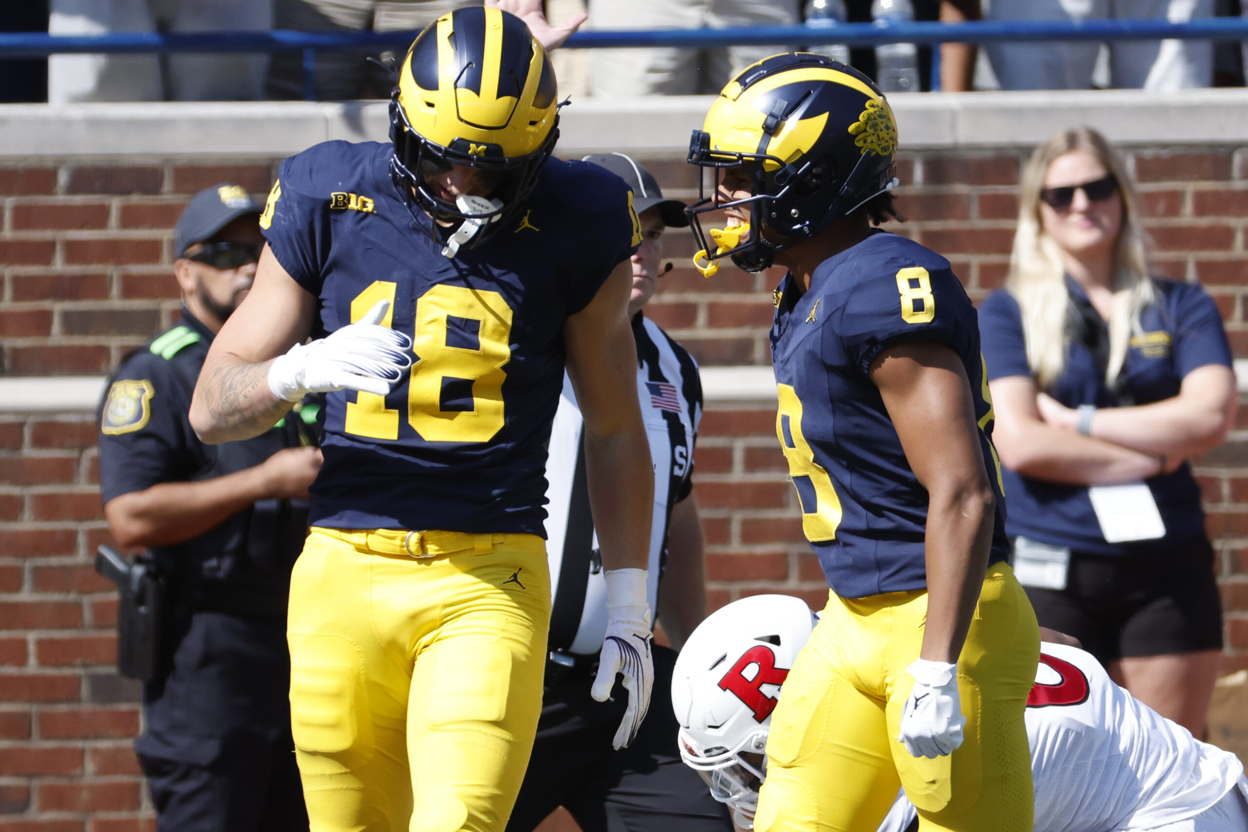 Sep 23, 2023; Ann Arbor, Michigan, USA; Michigan Wolverines tight end Colston Loveland (18) celebrates with wide receiver Tyler Morris (8) after a play against the Rutgers Scarlet Knights in the first half at Michigan Stadium.