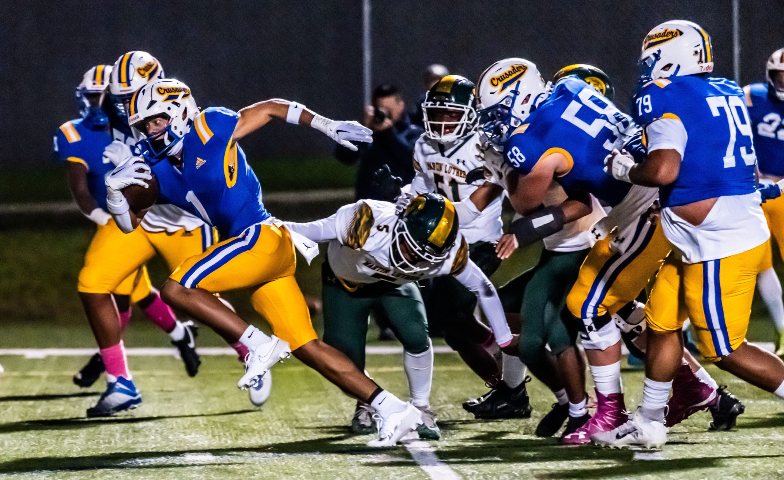 Catholic Memorial's Corey Smith (1) breaks free for a 16-yard touchdown run during the WIAA Level 1 playoff game against Martin Luther at Carroll University in Waukesha, Friday, October 20, 2023.