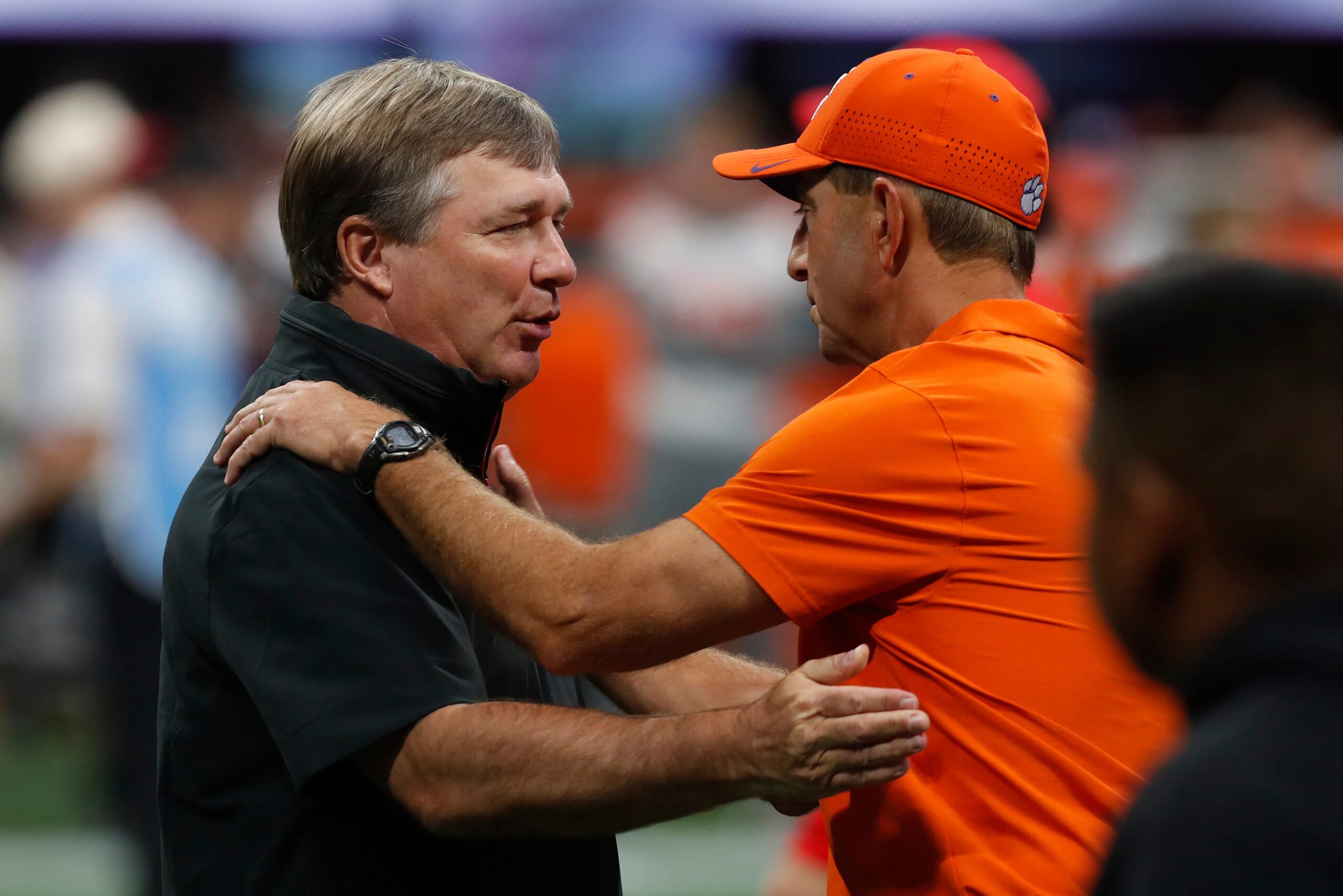 Georgia coach Kirby Smart and Clemson head coach Dabo Swinney speak before the start of the NCAA Aflac Kickoff Game in Atlanta, on Saturday, Aug. 31, 2024.