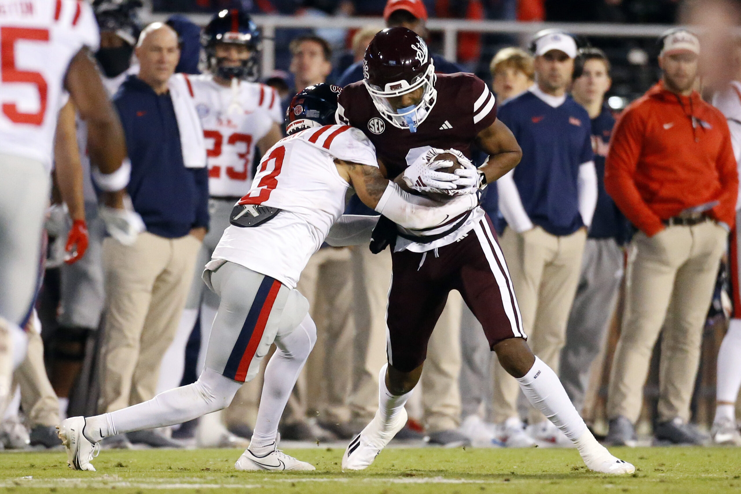 Nov 23, 2023; Starkville, Mississippi, USA; Mississippi State Bulldogs wide receiver Justin Robinson (3) runs after a catch as Mississippi Rebels defensive back Daijahn Anthony (3) makes the tackle during the first half at Davis Wade Stadium at Scott Field.