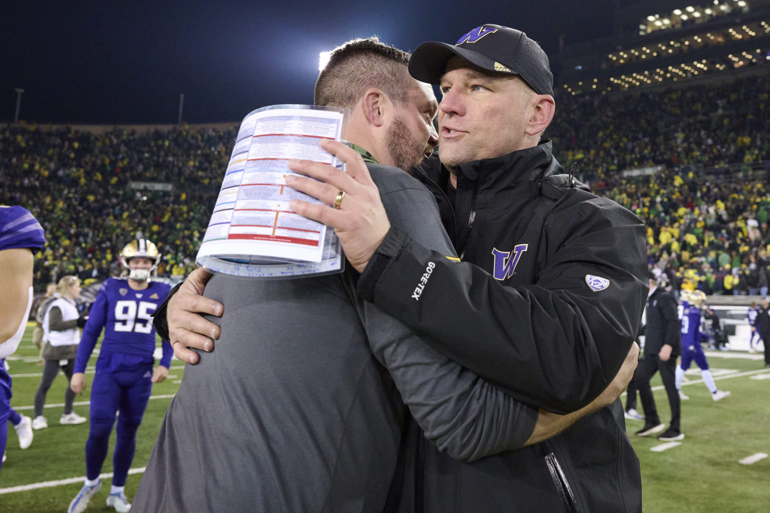 Nov 12, 2022; Eugene, Oregon, USA; Oregon Ducks head coach Dan Lanning congratulates Washington Huskies head coach Kalen DeBoer after a game at Autzen Stadium. The Huskies won the game 37-34.