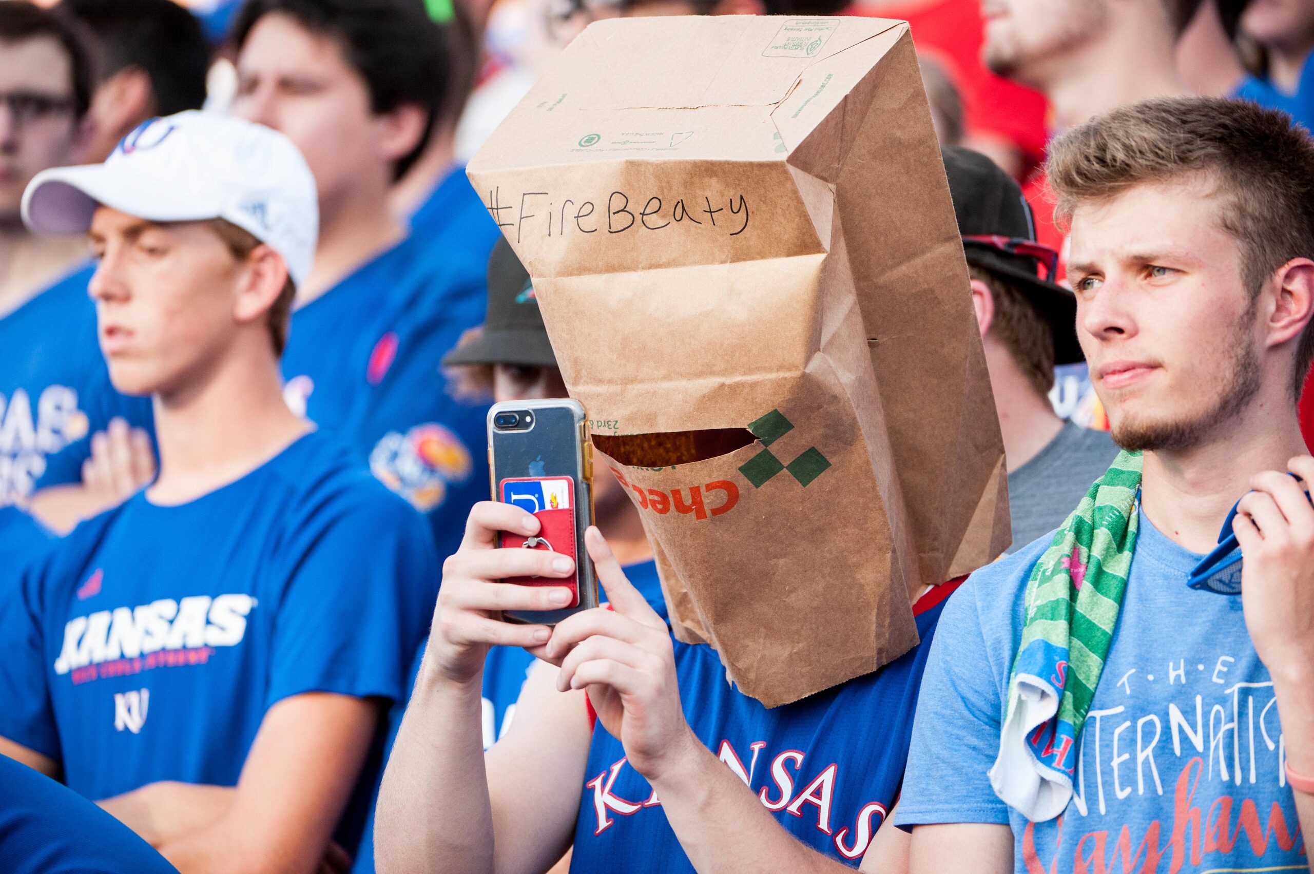 Sep 1, 2018; Lawrence, KS, USA; A Kansas Jayhawks fan wears a paper sack on his head with the phrase 