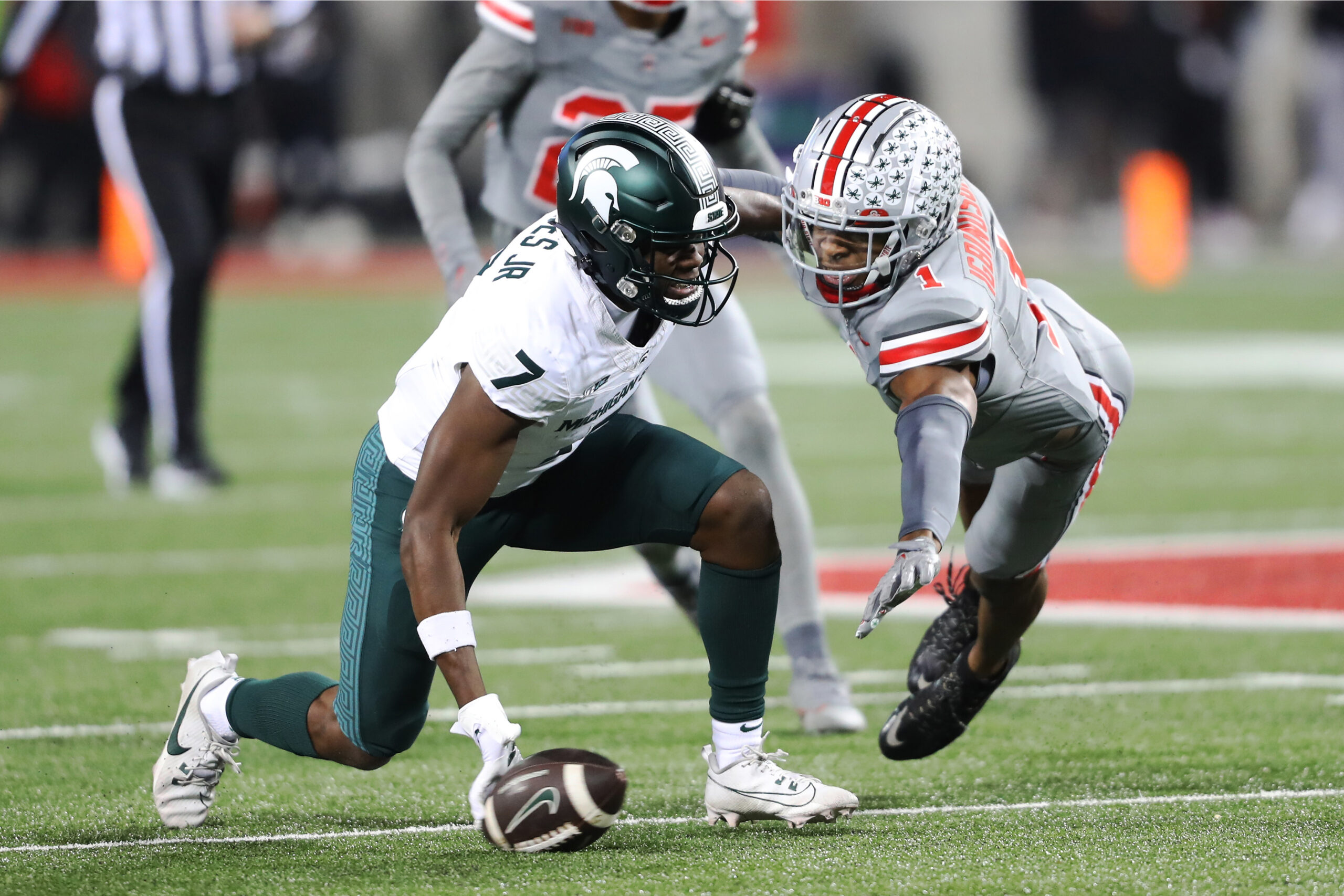 Nov 11, 2023; Columbus, Ohio, USA; Ohio State Buckeyes cornerback Davison Igbinosun (1) breaks up the pass intended for Michigan State Spartans wide receiver Antonio Gates Jr. (7) during the third quarter at Ohio Stadium