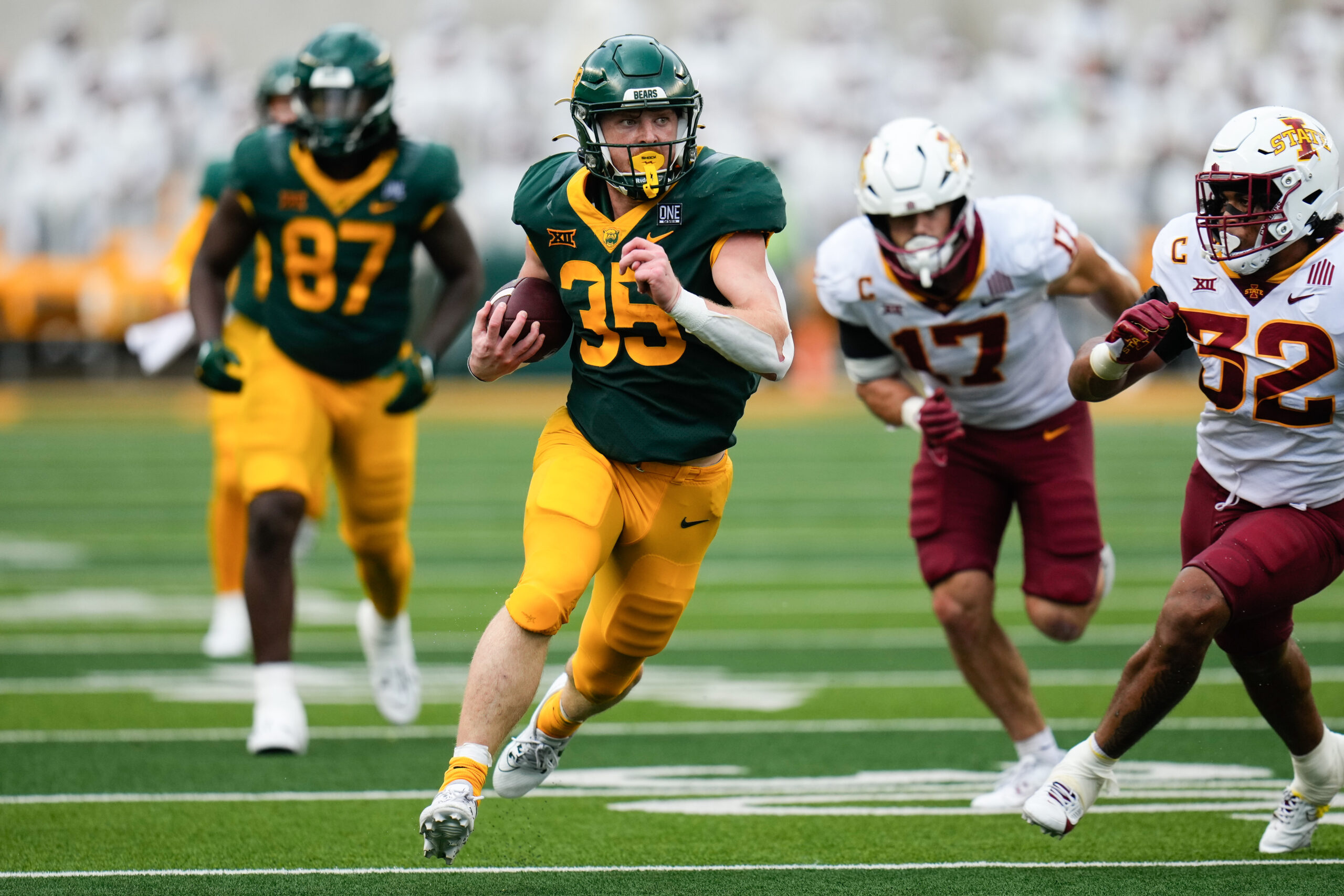 Oct 28, 2023; Waco, Texas, USA; Baylor Bears running back Dawson Pendergrass (35) runs the ball as Iowa State Cyclones linebacker Gerry Vaughn (32) pursues during the second half at McLane Stadium.