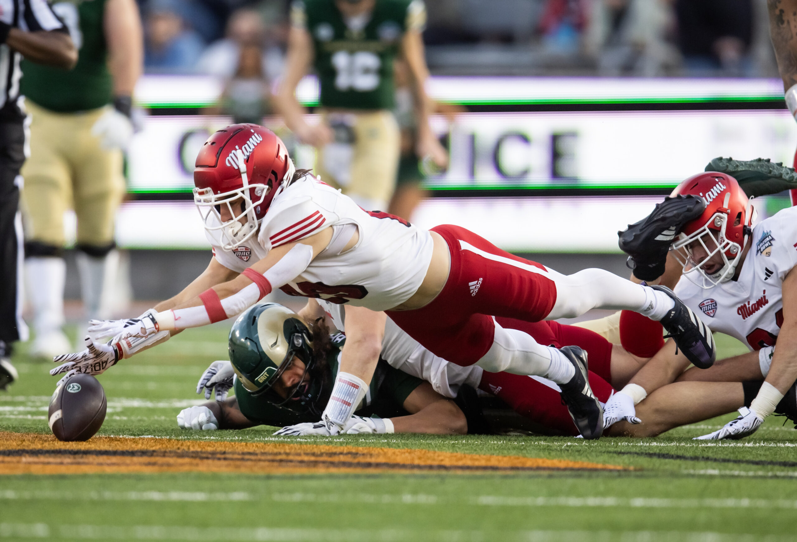 Dec 28, 2024; Tucson, AZ, USA; Miami (OH) RedHawks defensive back Silas Walters (29) recovers a fumble against the Colorado State Rams during the Snoop Dogg Arizona Bowl at Arizona Stadium.