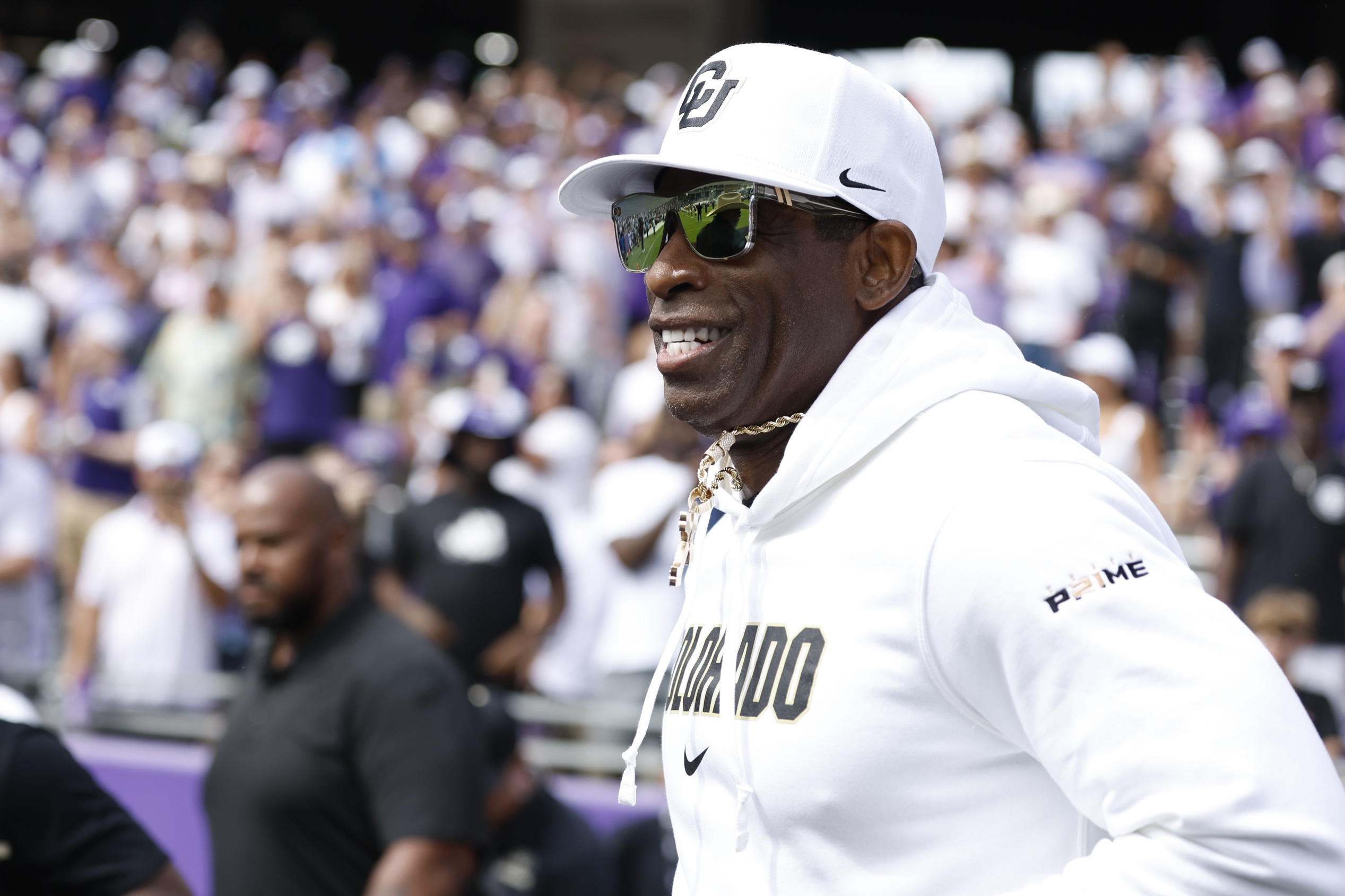 Sep 2, 2023; Fort Worth, Texas, USA; Colorado Buffaloes head coach Deion Sanders runs on the field before the game against the TCU Horned Frogs at Amon G. Carter Stadium.